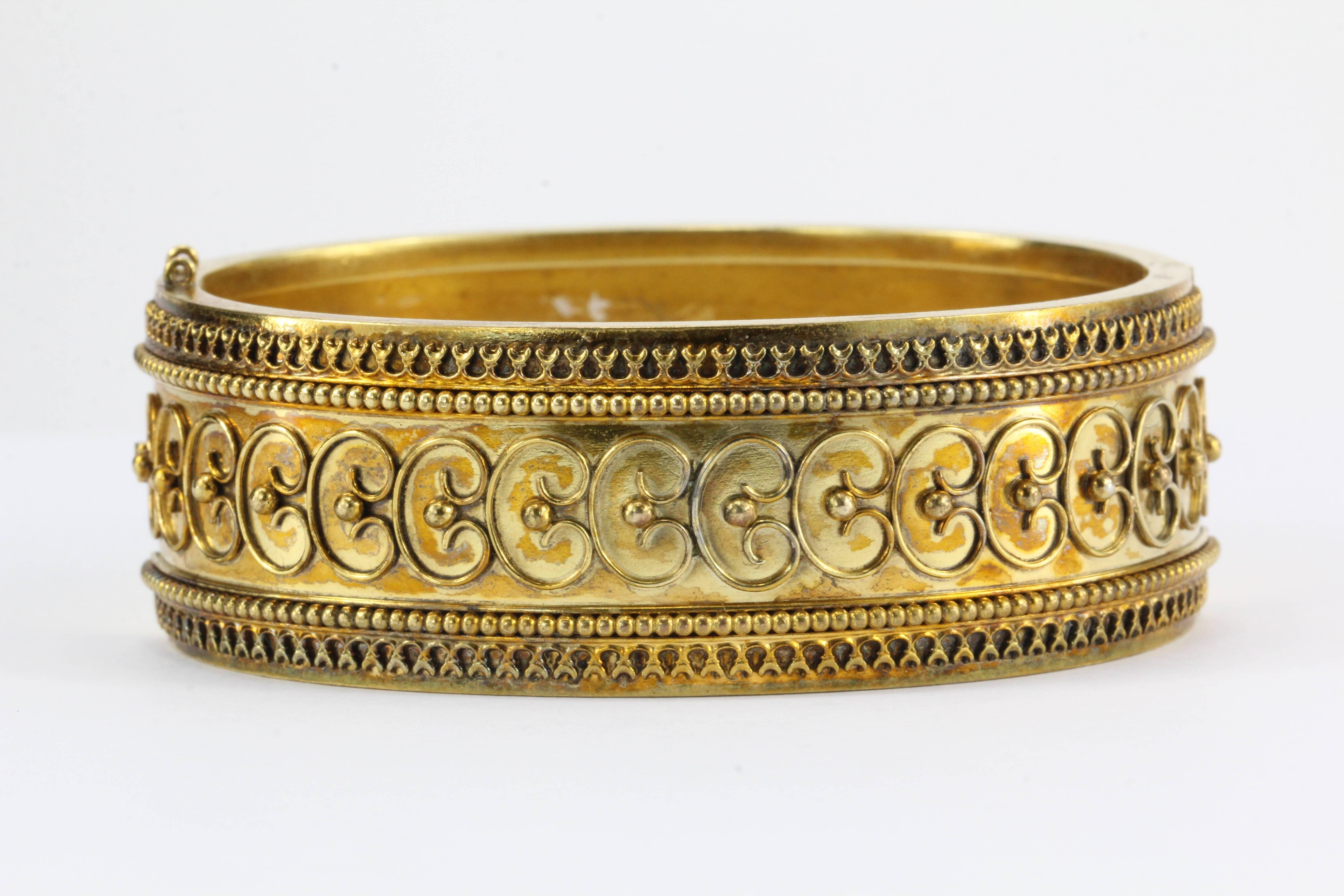 Lovely 15K Yellow Gold Victorian Era Etruscan Revival Bangle in Original Fitted Case from A. Mears 50 Strand London

c.1880

The bangle weighs 31 grams

Measures 23mm wide

56mm inner diameter x 46mm inner diameter