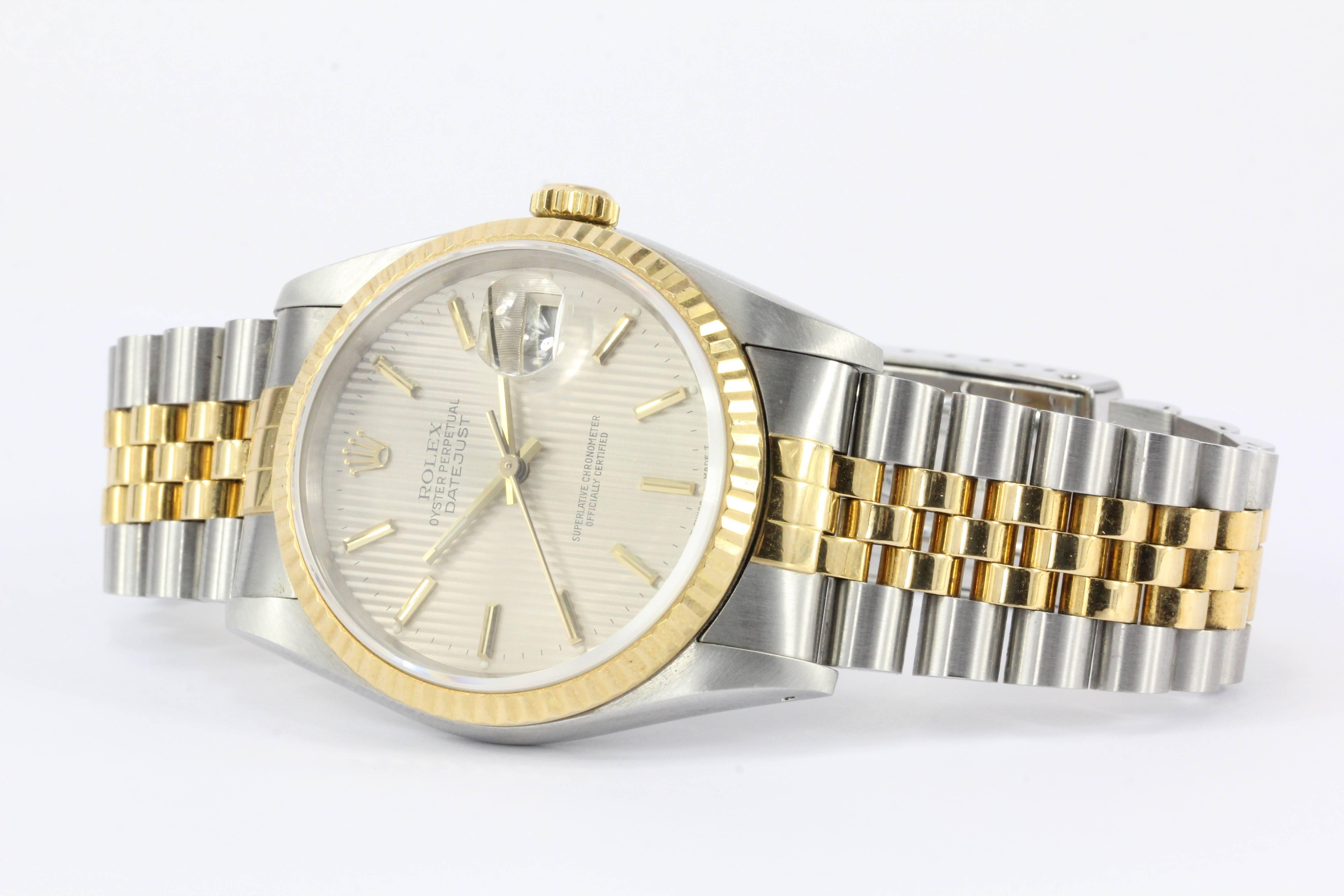 Brand: Rolex

Model #: 16233

Year: L Serial Number Circa 1990

Composition: Stainless Steel & 18K Yellow Gold

Watch Bezel: 36MM

Watch Dial: Champagne Tapestry Dial 

Crystal: Sapphire

Comes with Original Box & Papers 

Condition: Fabulous estate