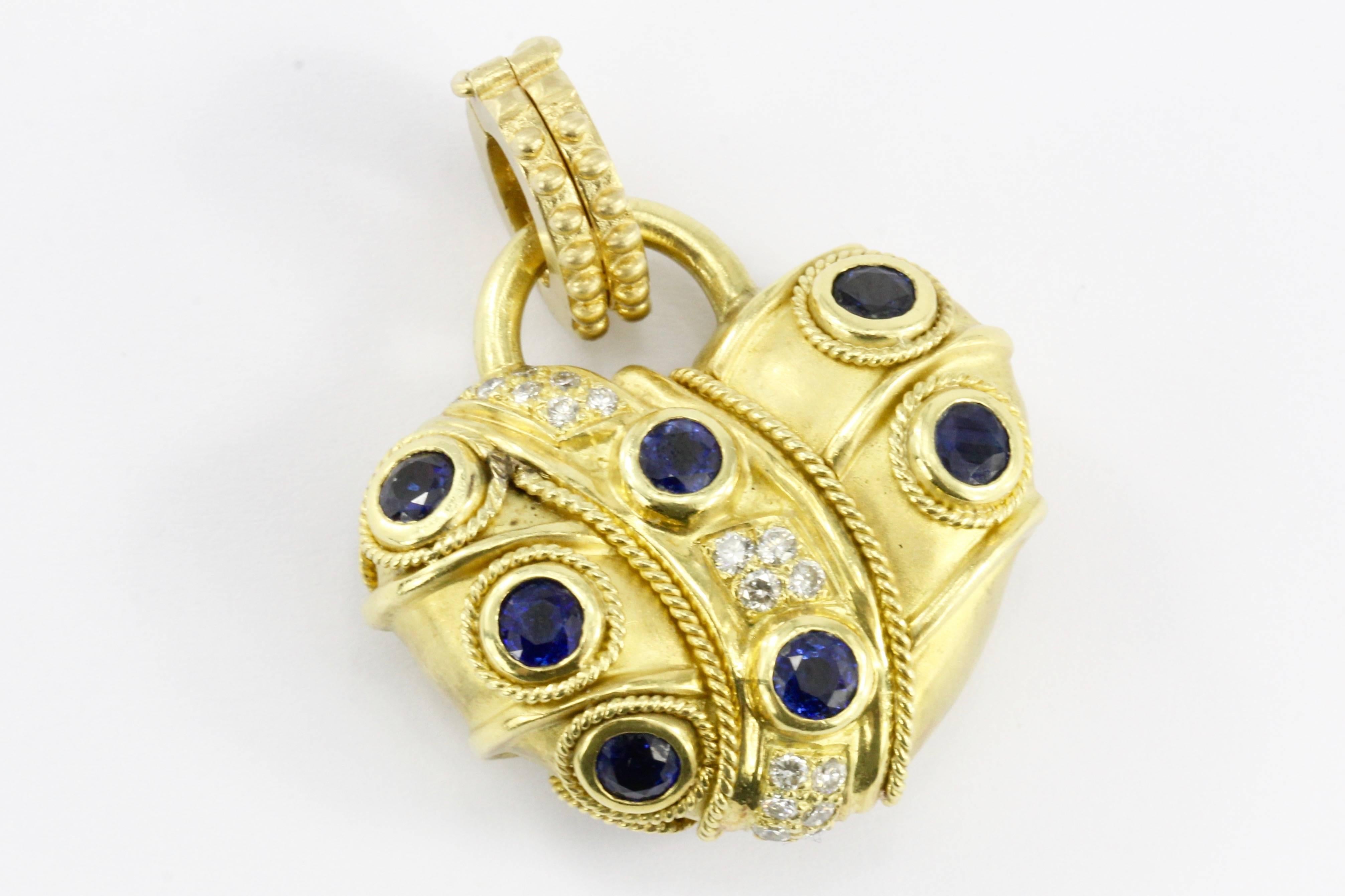 Era: Modern

Composition: 18K Brushed Yellow Gold

Primary Stone: Natural Sapphire 

Primary Stone Carat Weight: 2.5 CTW

Secondary Stone: Natural Ruby

Secondary Stone Carat Weight: 2.5 CTW

Tertiary Stone: Diamond

Tertiary Stone Carat Weight: .50