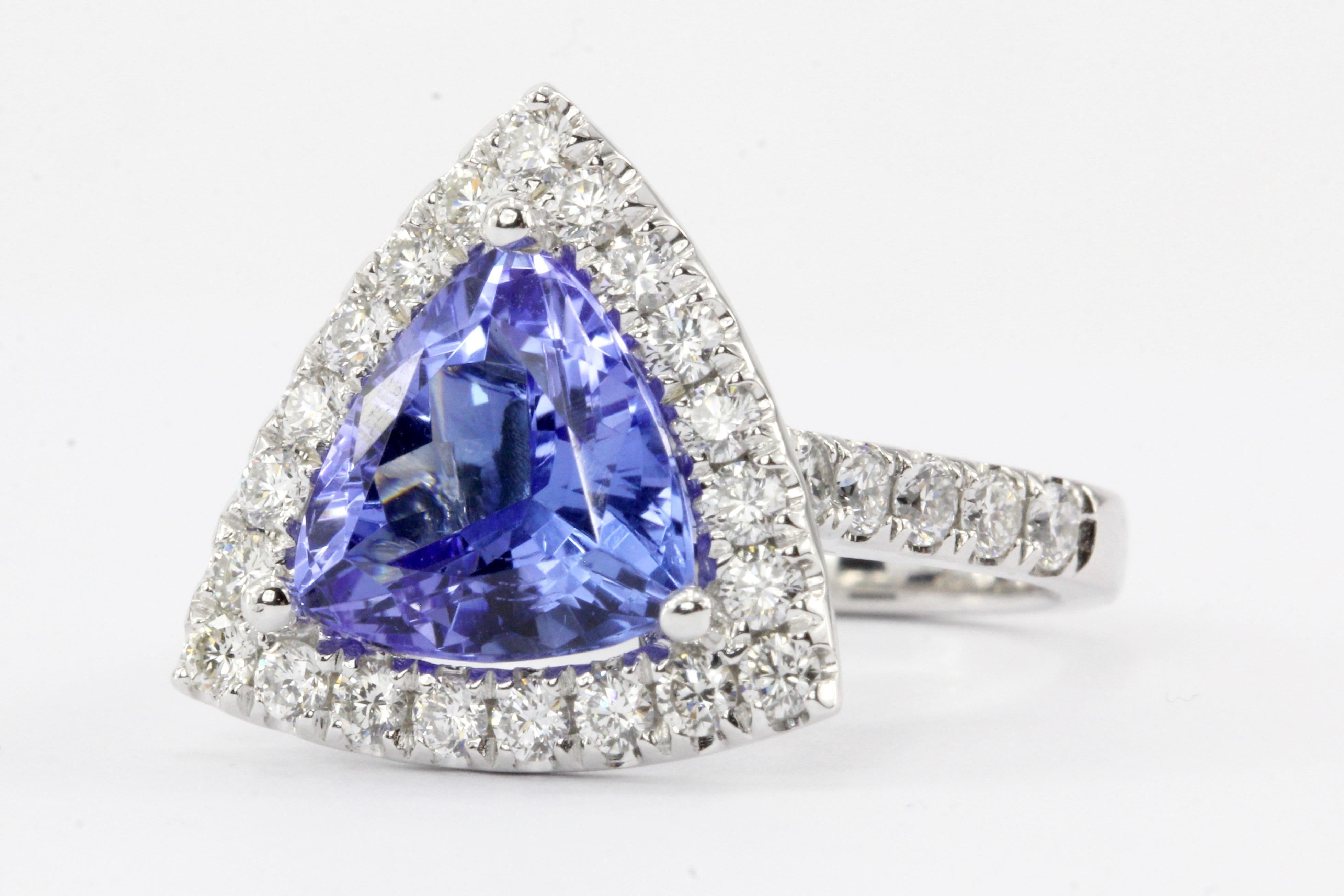Era: Modern

Composition: 14K White Gold

Primary Stone: Tanzanite

Carat Weight: 4 Carats

Secondary Stone: Diamond

Carat Weight: 1.30 CTW

Color: G/H

Clarity: Vs2/Si1

Size: 6