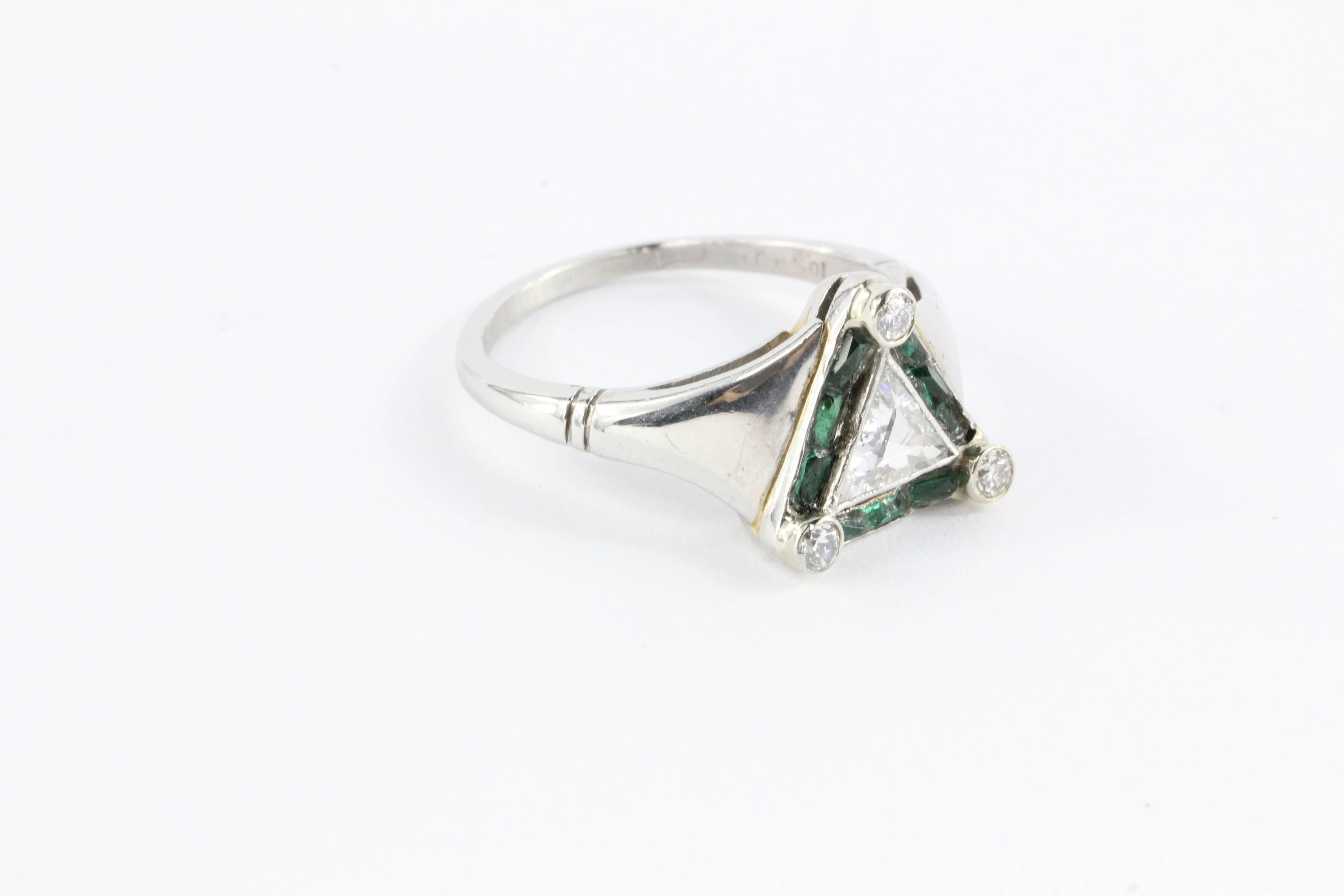 Exquisite and extremely hard to find antique authentic period Art Deco Platinum Trillion (Triangle) 1 Ct Diamond & Emerald Engagement Ring.  It is hallmarked 10% IRID.  The piece is most likely from the 1920's and was custom made. The center