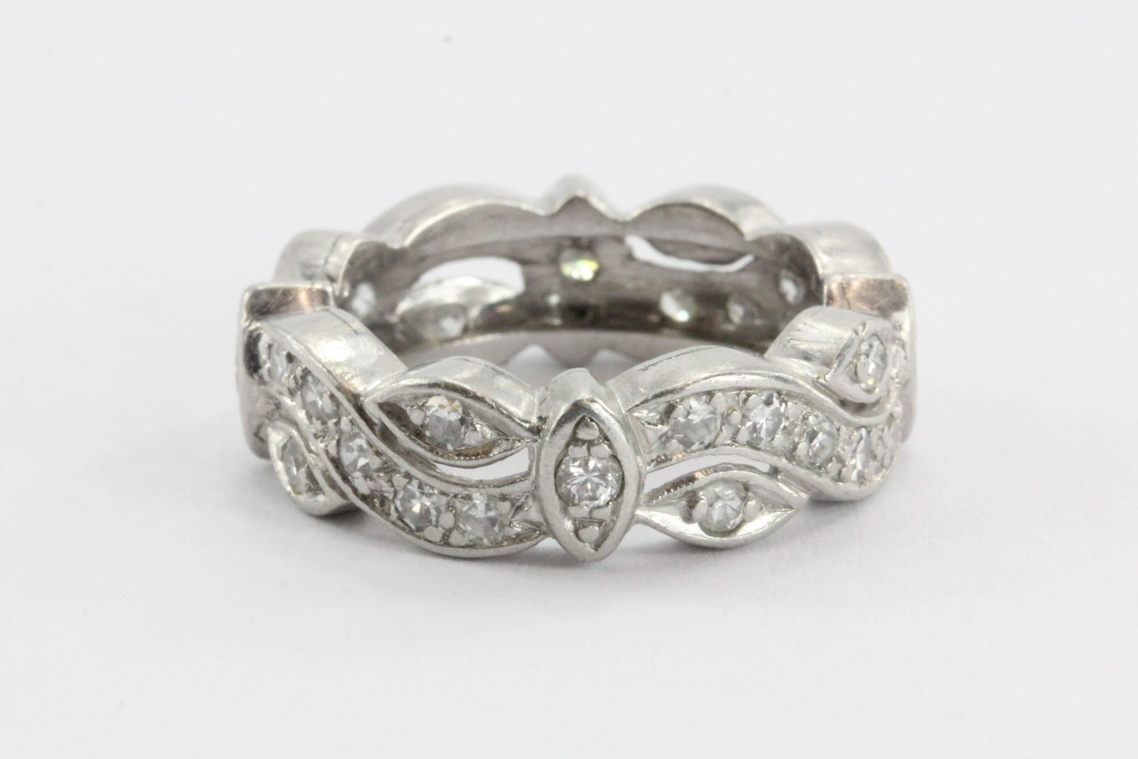 Antique Art Deco Diamond Wedding Band Vintage Eternity Cigar Band

The ring is made of platinum and set with 1.2 CTW of single cut F color, Vs2 clarity diamonds. There are 24 .05 carat diamonds wrapped completely around the band. The ring is in