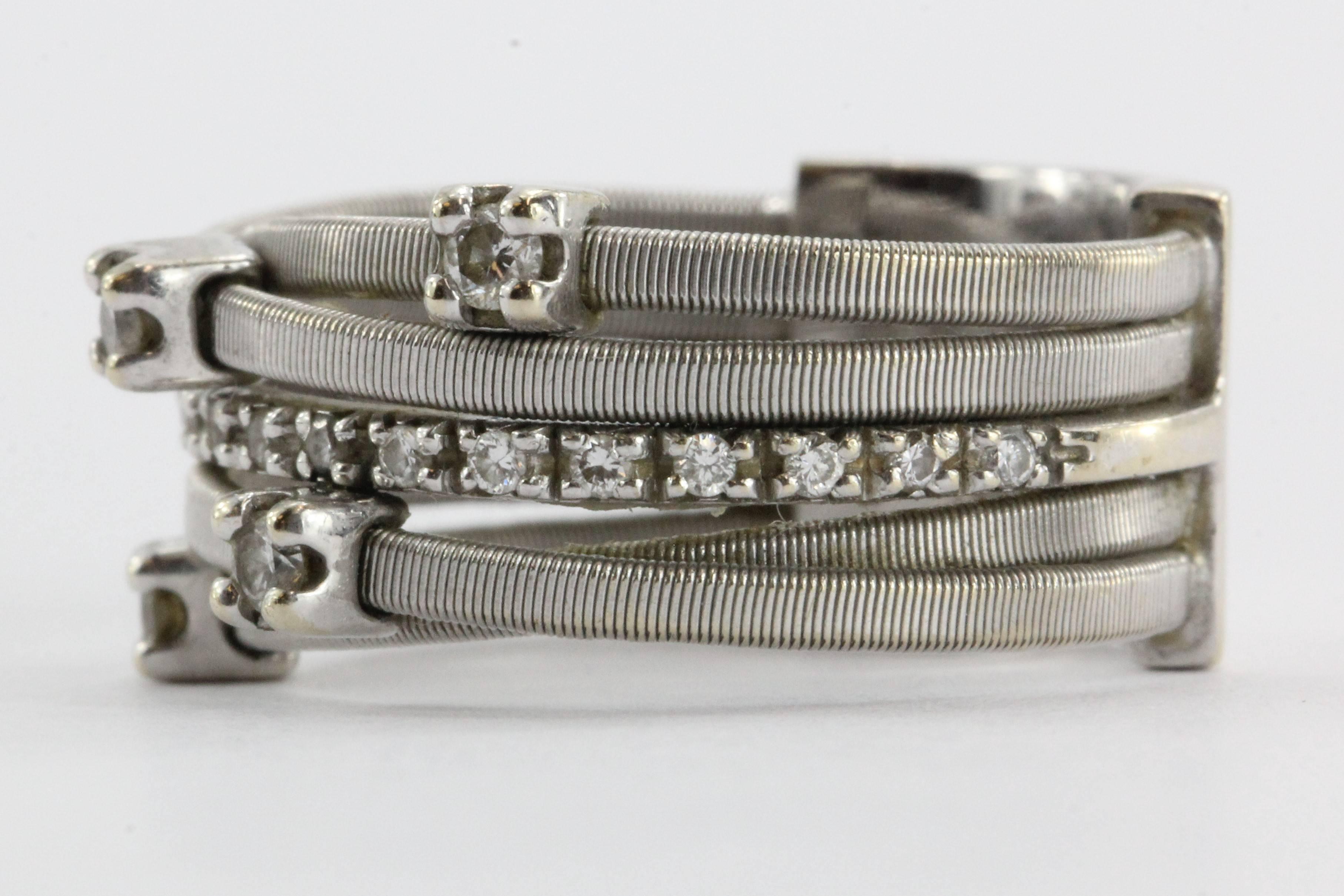  Marco Bicego GOA 18K White Gold 5 Row Diamond Ring. The ring is in excellent used estate condition, ready to wear. There is minor evidence of wear, only noticeable upon close inspection. The piece is signed 