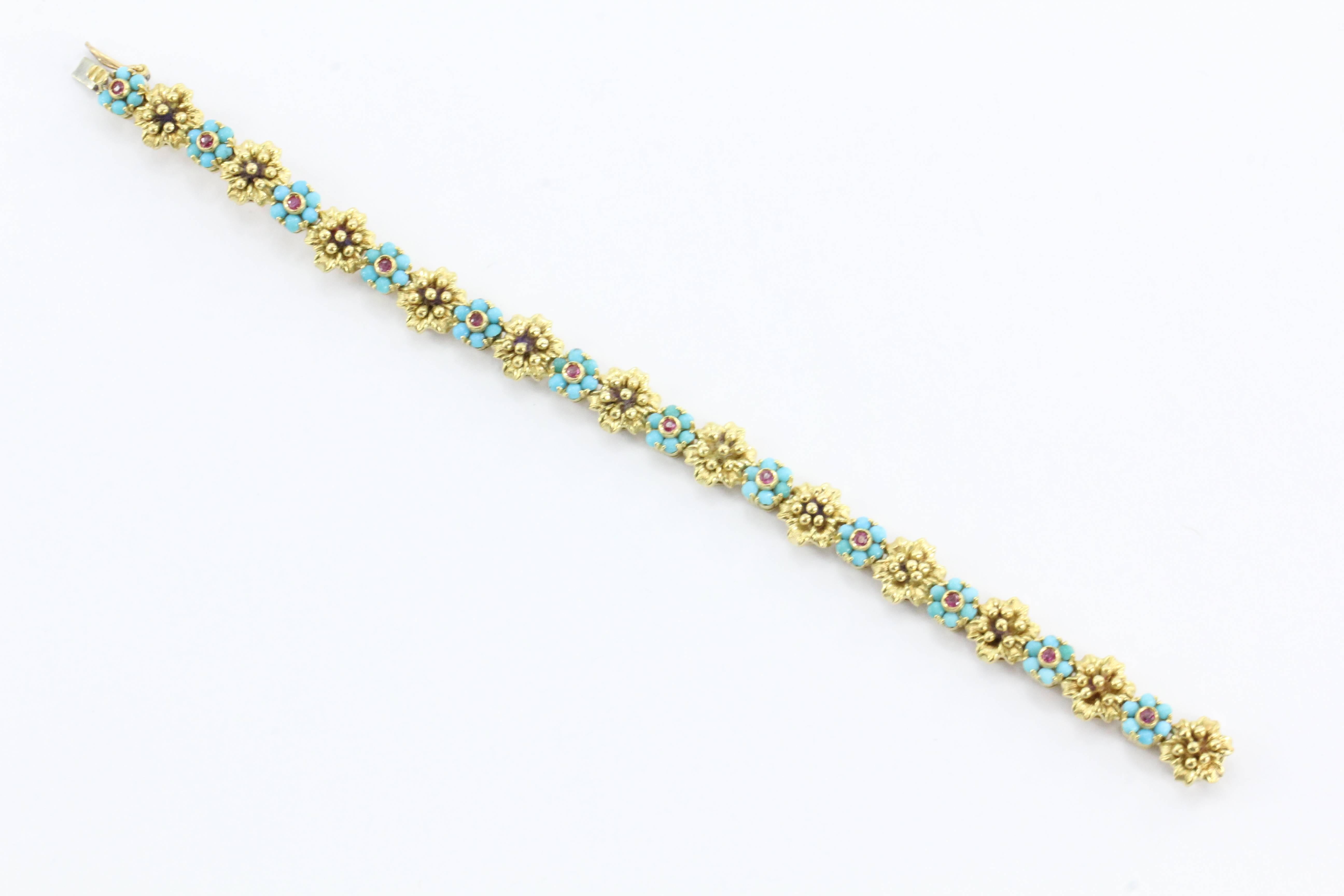 Vintage Custom handmade designer 18k yellow gold hinged link bracelet with genuine untreated Persian high gloss turquoise with a floral motif and genuine non heated rubies. Exquisite condition, no repairs or defects.

 A stunning piece guaranteed