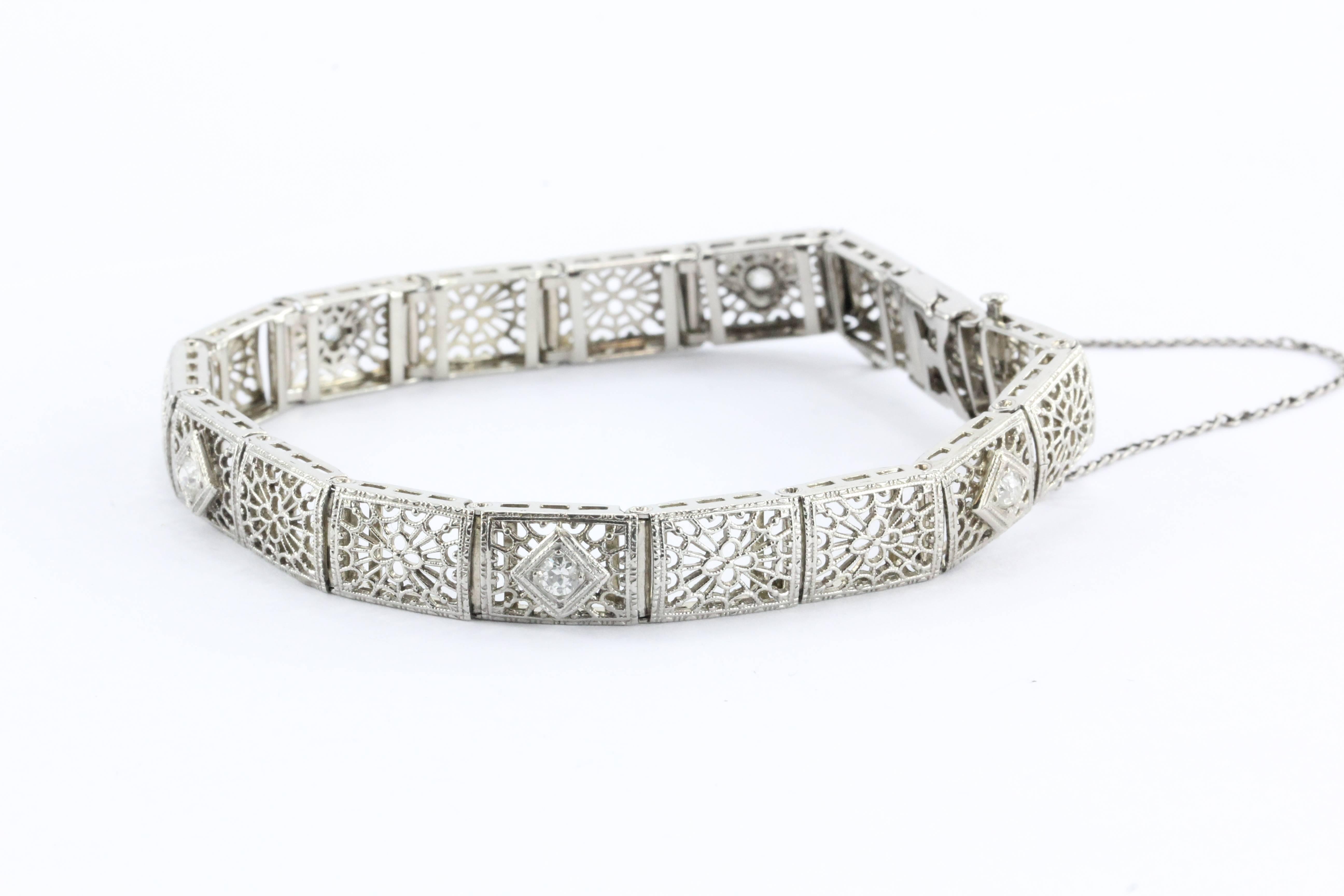  Antique Art Deco 14K White Gold & Old Mine Diamond Bracelet .50 TCW. The piece is in excellent estate condition, the filigree is flawless with no bends or breaks. The clasp and safety chain still work perfectly. The piece is hallmarked 14K on the