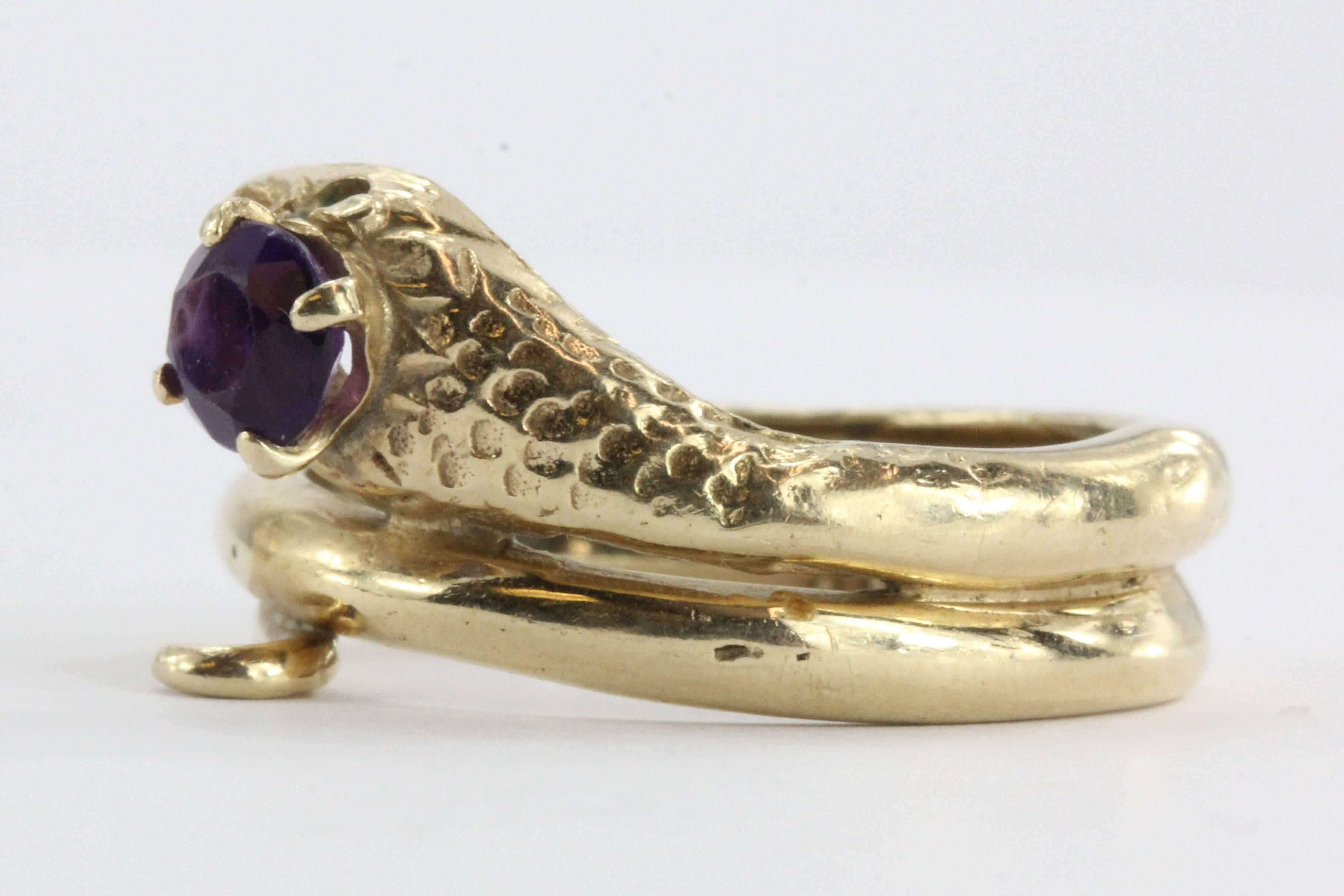 14K Gold & Amethyst Figural Gothic Curled Coiled Snake Ring. The ring is in excellent estate condition and ready to wear. It is hallmarked 14K but there is not a makers mark that I can find anywhere. The snake's head is set with an approximately .40
