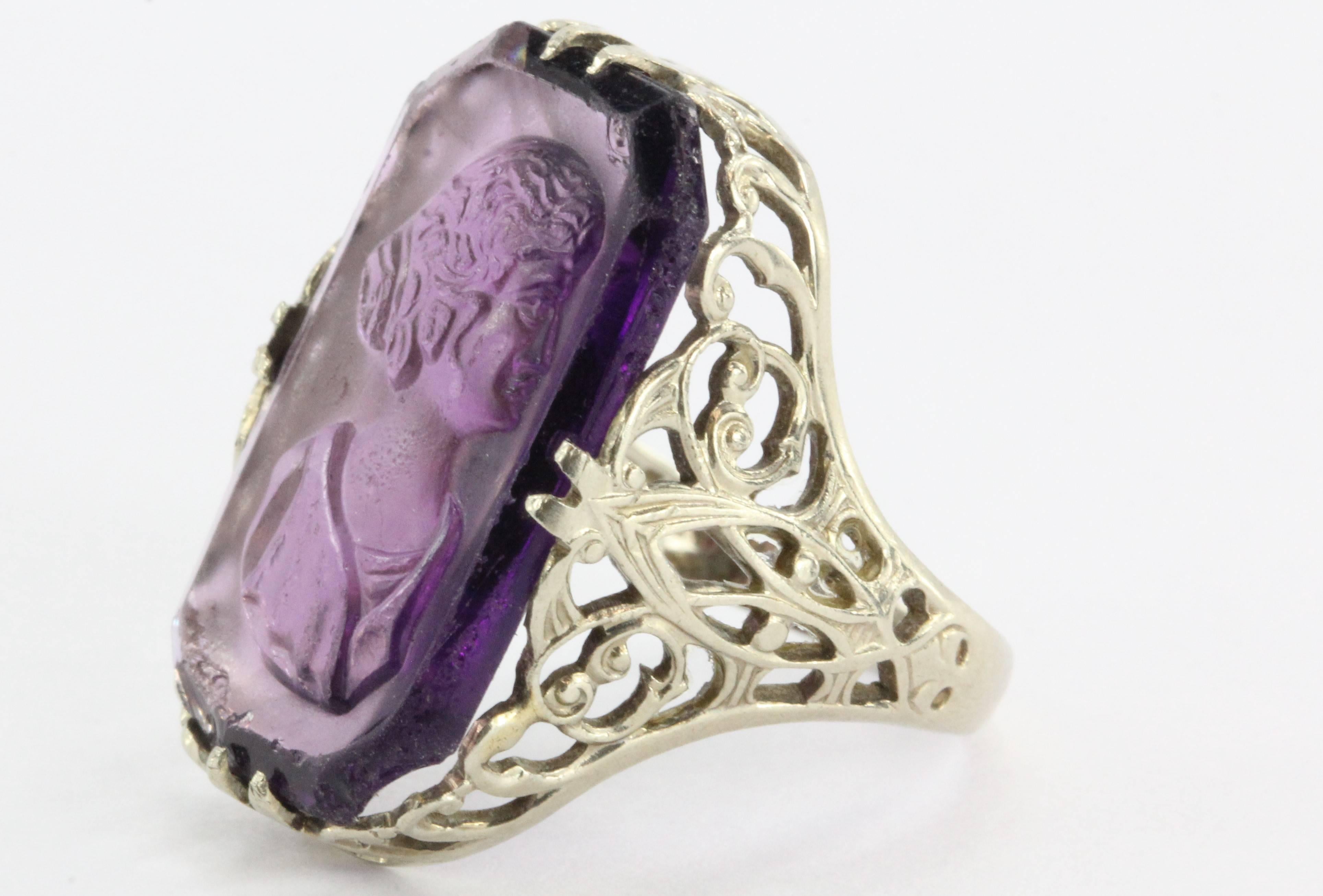 Antique Victorian 14K White Gold Purple Amethyst Glass Cameo Ring Signed. The ring is in great antique estate condition but the cameo is a little loose and it is chipped on its edges. It is hallmarked on the inside 14K and what looks like a small S.