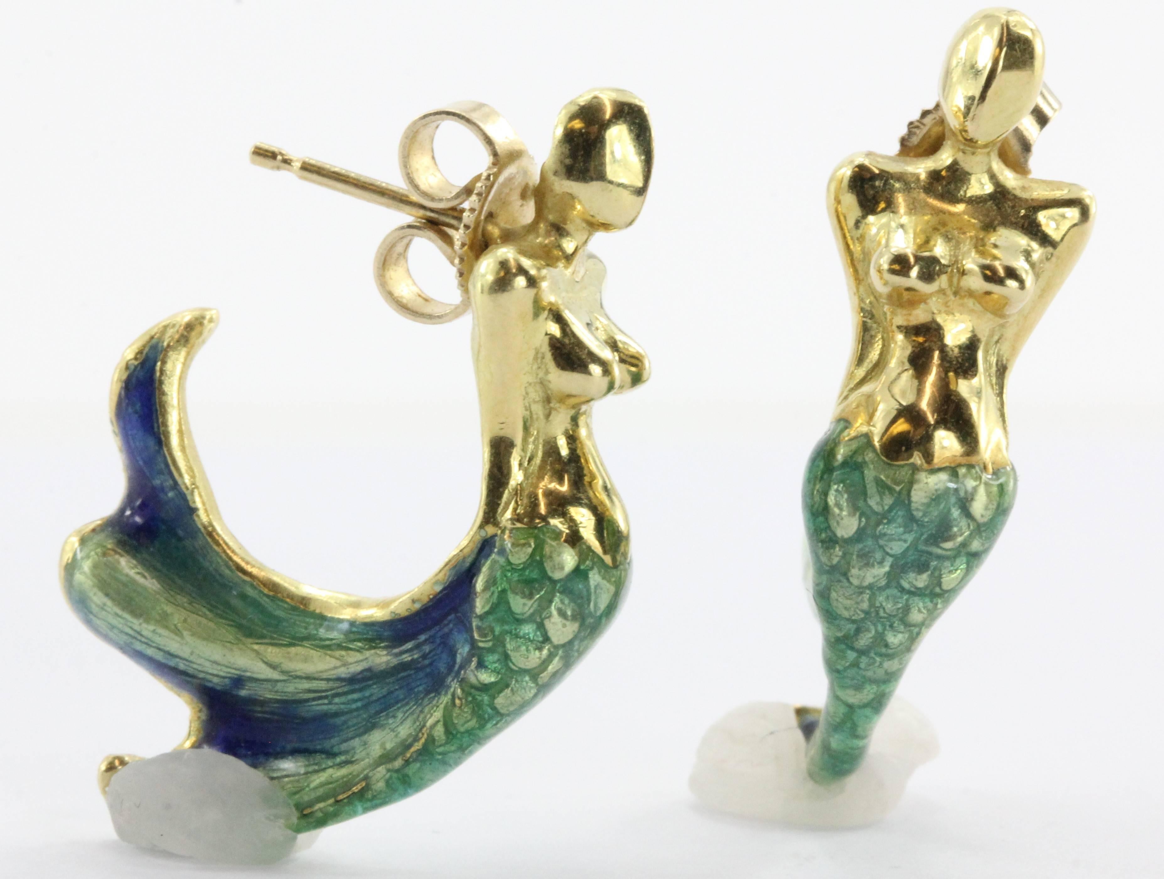 18K Gold  Blue & Green Enamel Figural Mermaid Earrings Signed. The earrings are in excellent estate condition and ready to wear. There are no cracks, chips or scratches to the enamel. The 14K gold backs are not original to the piece. The earrings