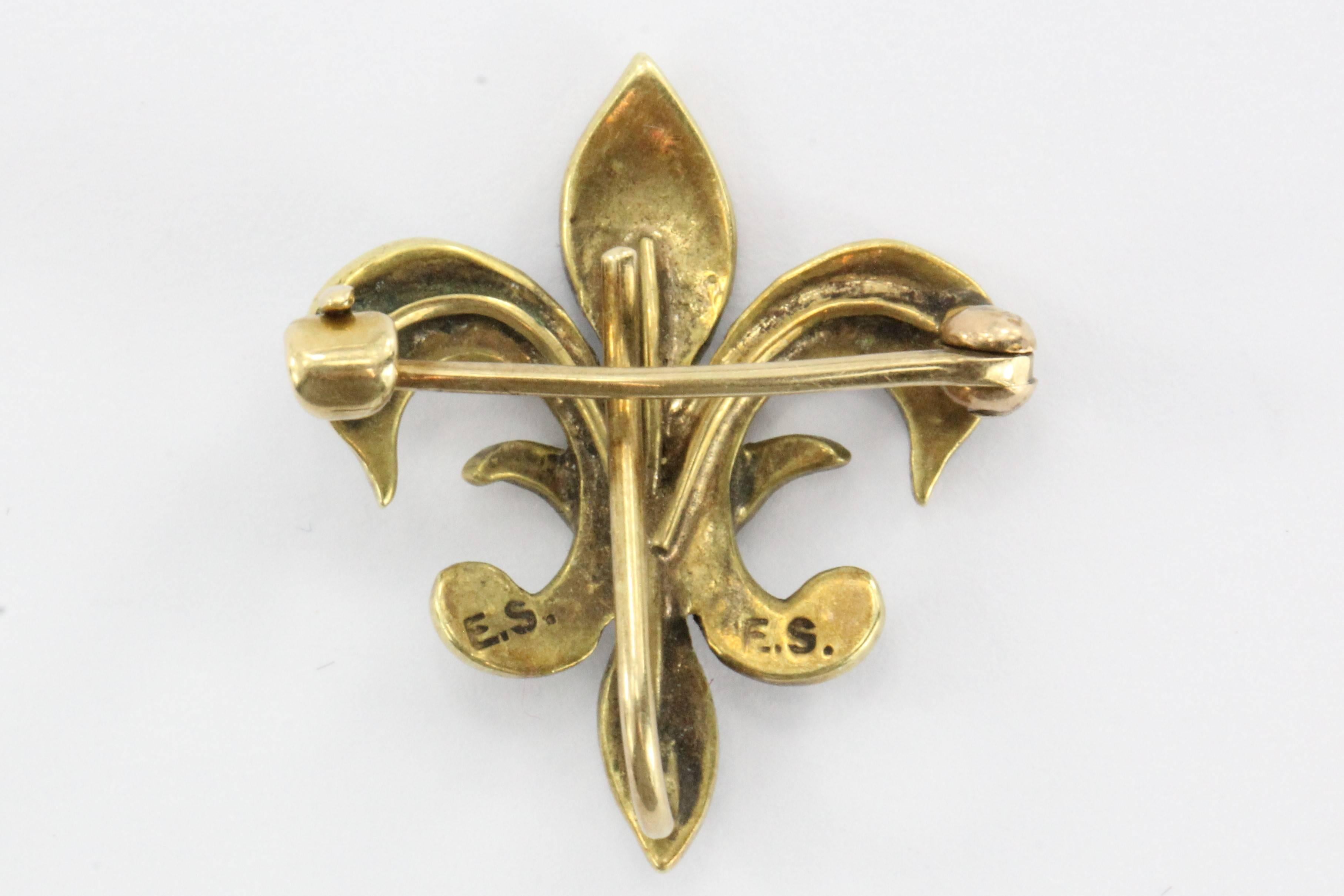 Antique 14K Gold & Seed Pearl Fleur De Lis Pin by Ehrlich & Sinnock. The piece is in excellent all original condition and ready to wear. It is signed E.S. twice on the back which is the makers mark for Ehrlich & Sinnock. They were in business