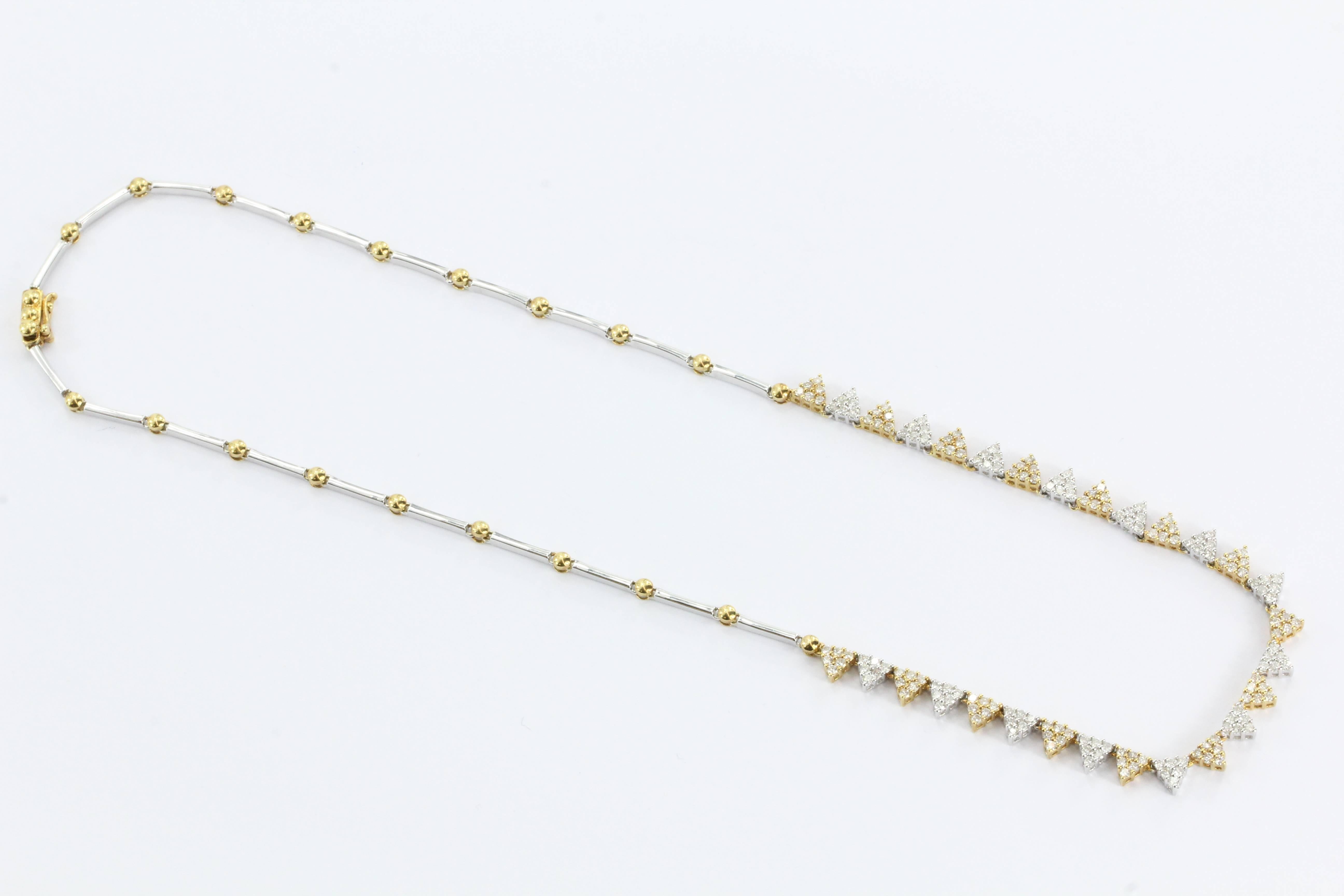 18K White & Yellow Gold Diamond Modernist Necklace. The necklace is in excellent estate condition, like new and ready to wear. It is hallmarked 750 twice and 18K on the clasp. There is no makers mark that I can find. It is made of alternating white