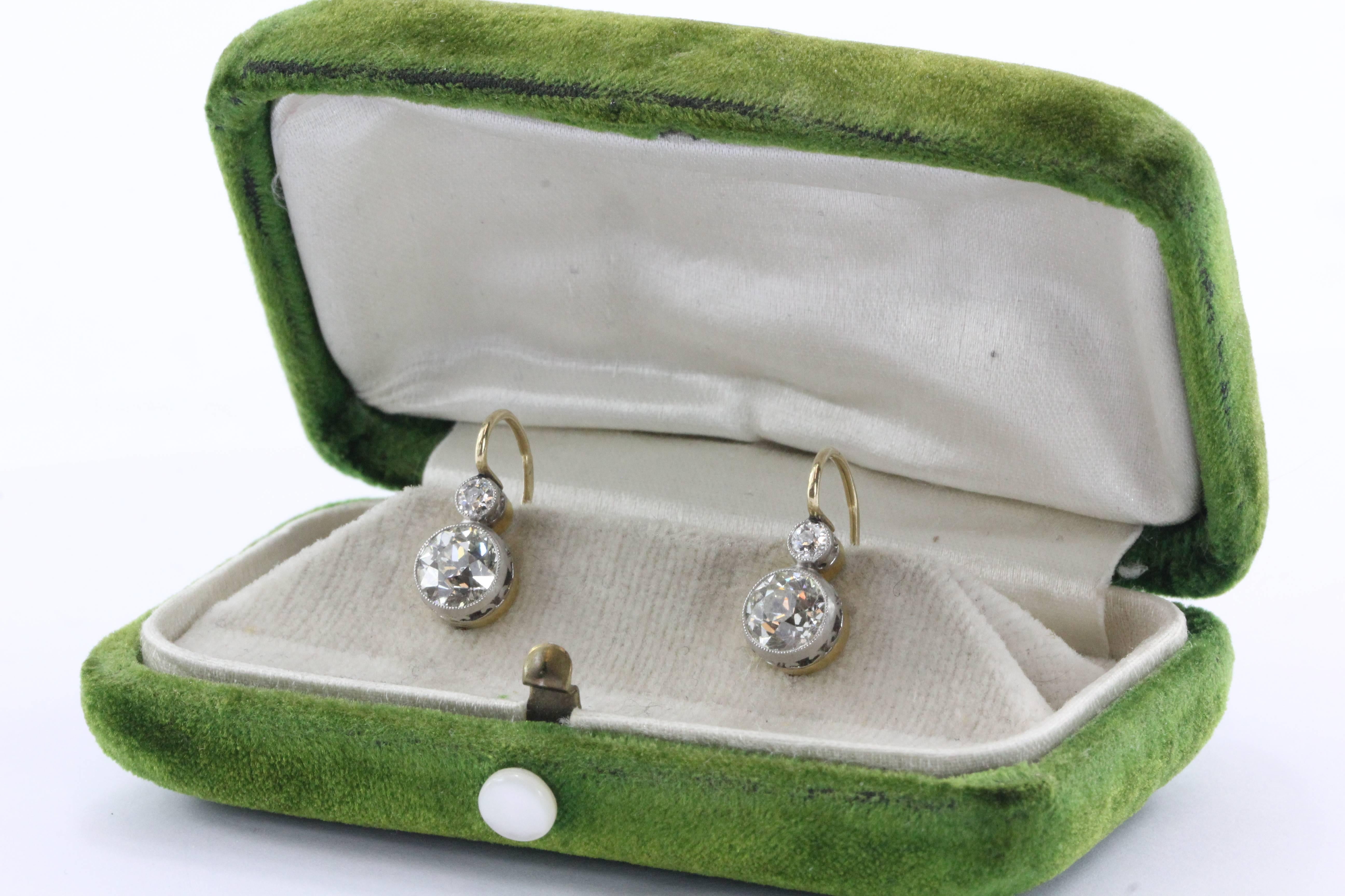 Edwardian 18K Gold with platinum top baskets 2.5 carat Old European cut diamond earrings. Hallmarked with the Russian hallmark used from 1908 - 1917 for items weighing under 8.5 grams. The mark was discontinued after the fall of the Czar. The