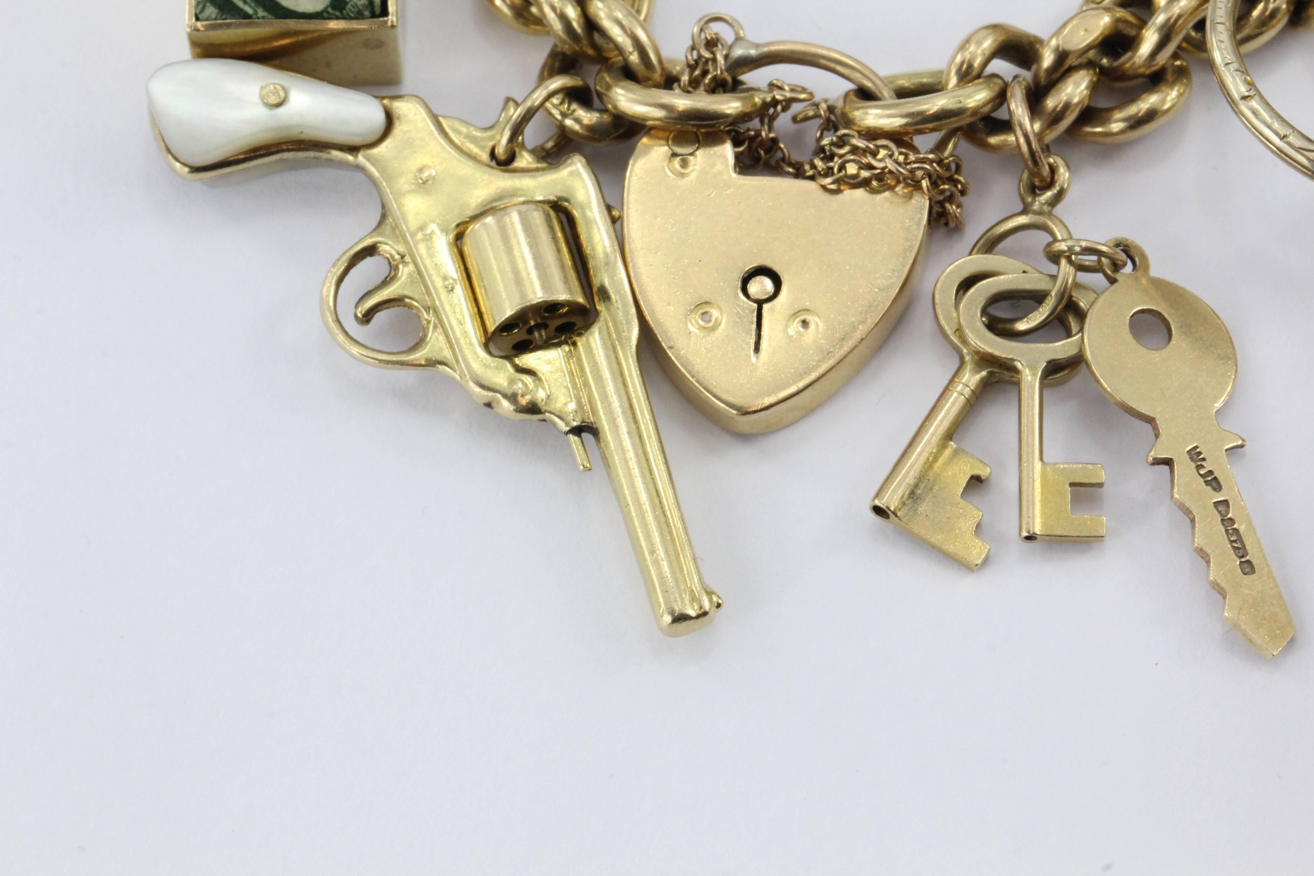 Antique 18K Gold English Tassie Seal heavy Loaded Charm Bracelet. The bracelet is in great estate condition and ready to wear. One of the charms is missing its glass. Every link on the bracelet is marked 18CT and the heart lock clasp is also marked