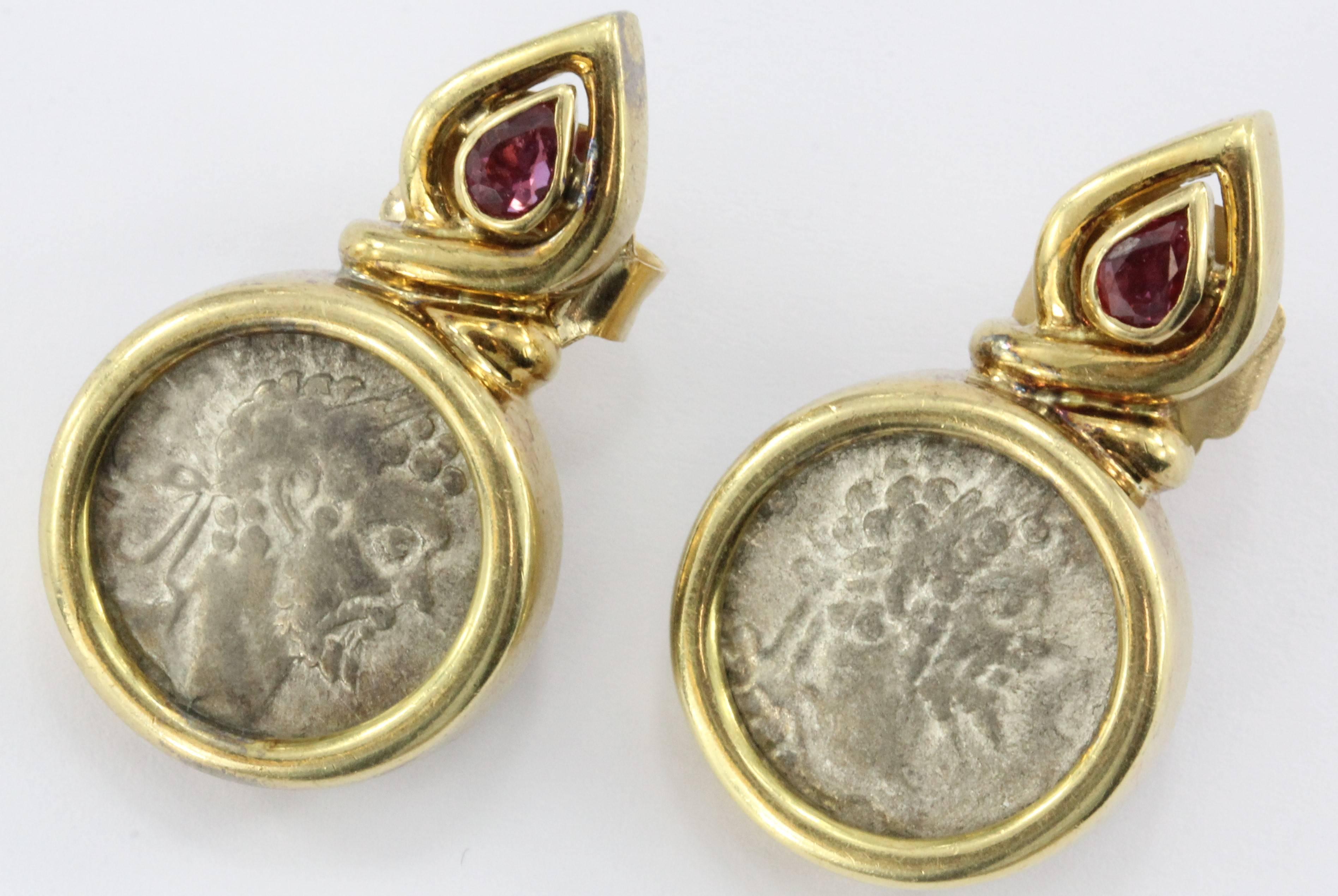 18K Gold & Ruby Roman Silver Denarius Coin Earrings. The earrings are in excellent estate condition and ready to wear. The earring backs are mismatched though. One is a replacement 14K gold back and the other is an original 18K back. The earrings