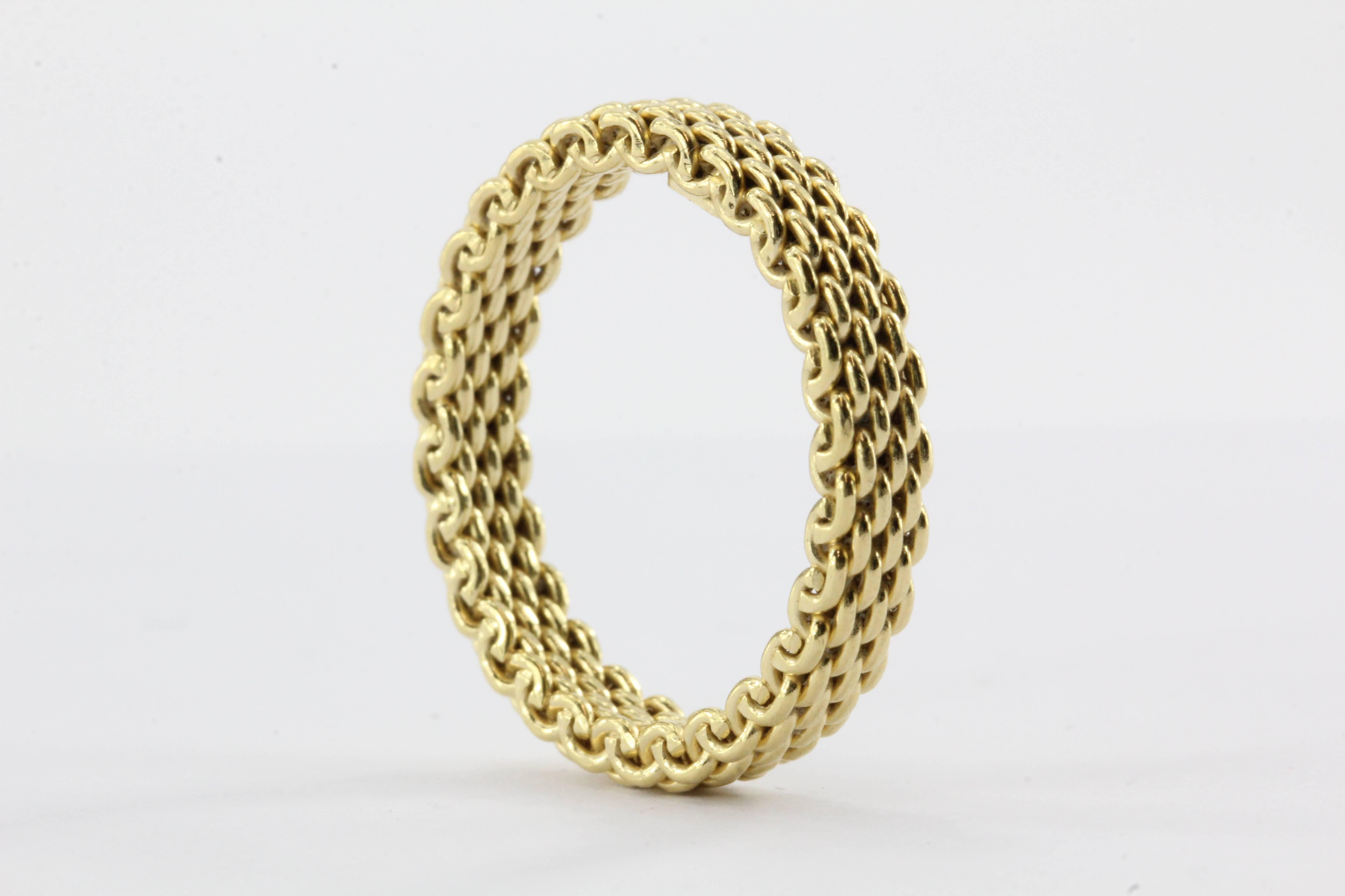 Tiffany & Co 18K Gold Somerset Mesh 3.5mm Band Ring Size 6.75. The ring is in excellent estate condition and ready to wear. It comes with its box and pouch. The ring is signed 