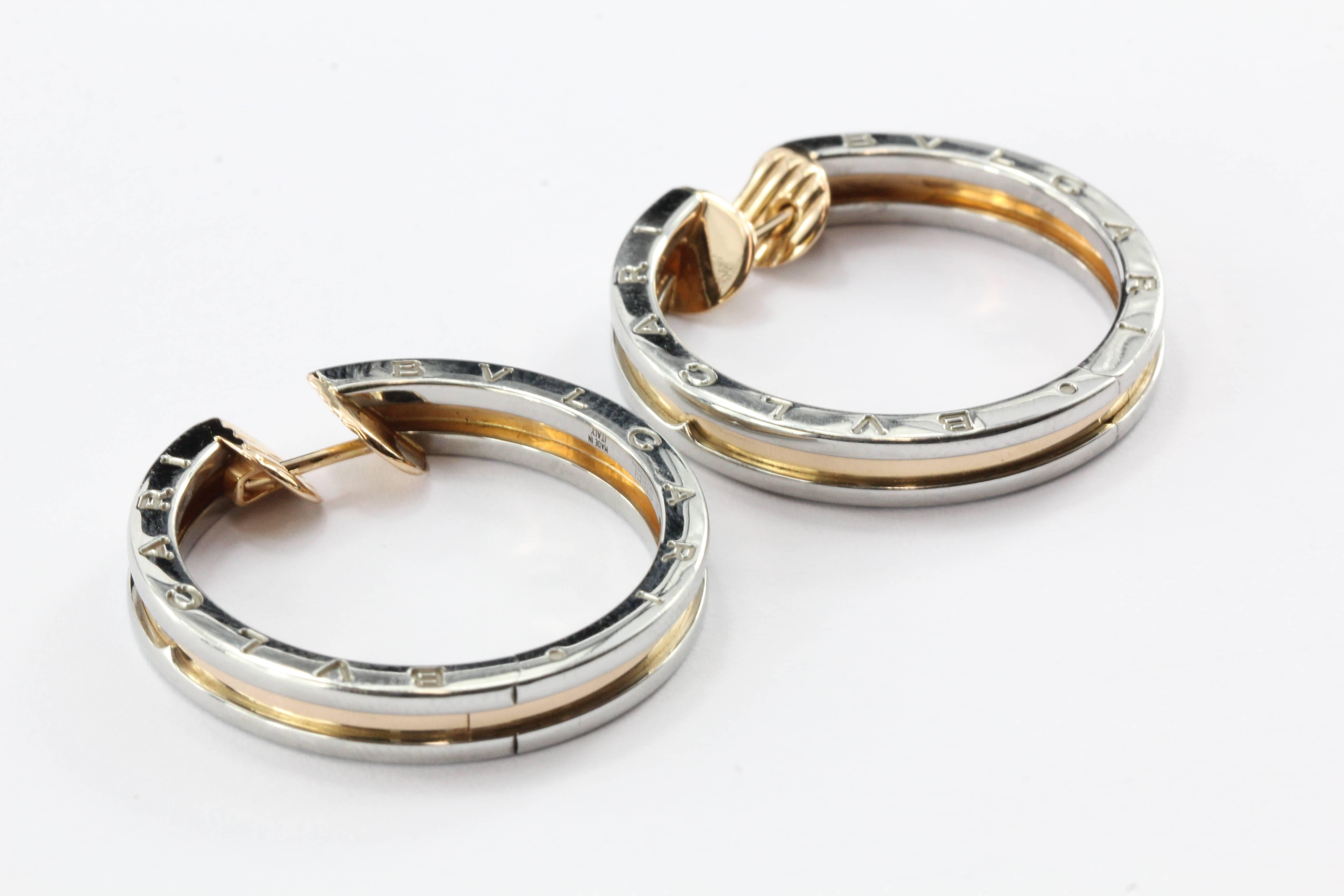 Bulgari B Zero 18K Pink Gold & Steel Hoop Earrings. The earrings are in excellent used estate condition and ready to wear. They come in their original case and box. They are signed 