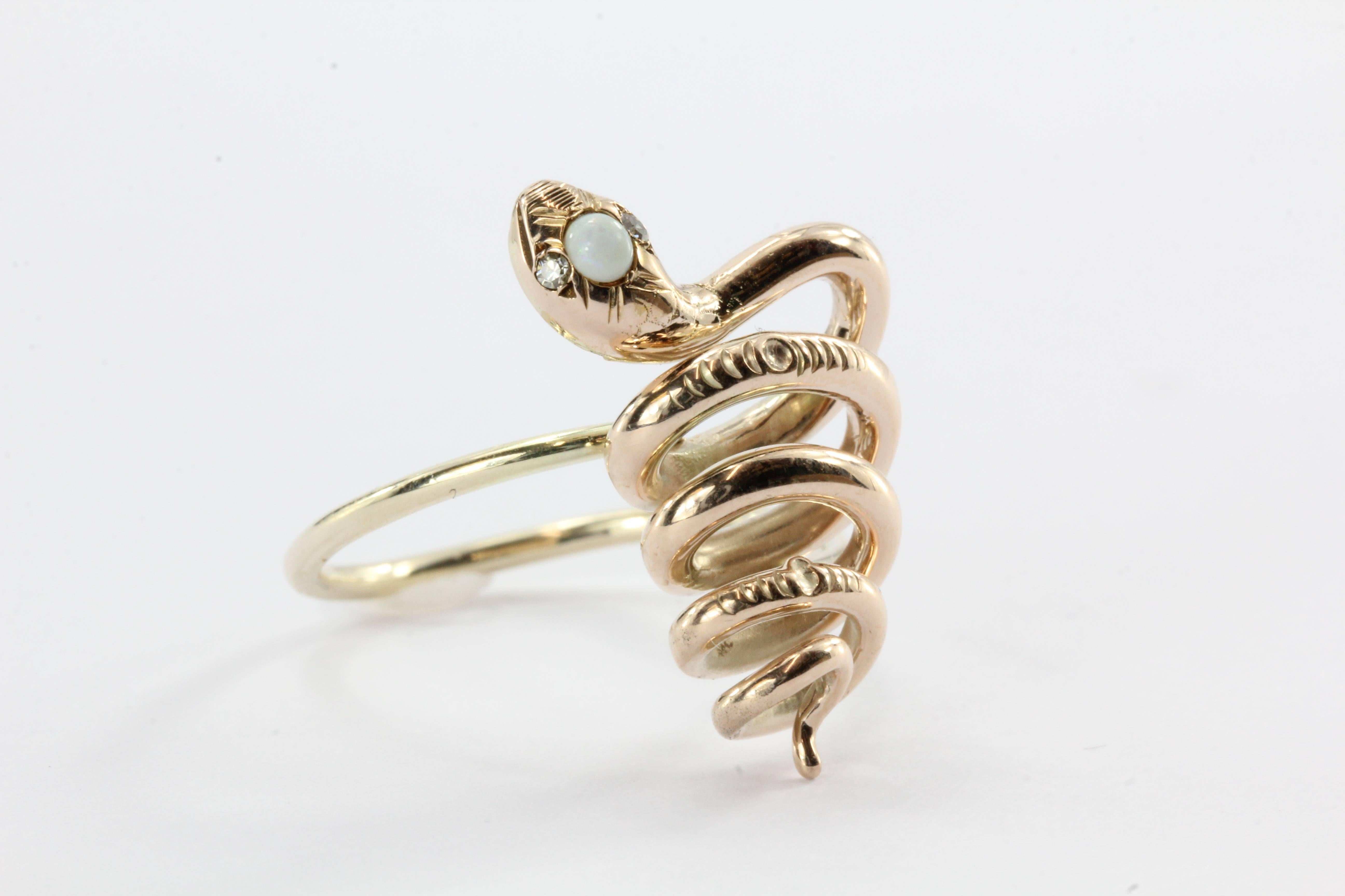 Antique Victorian 10K Gold Curly Twisted Snake Opal Diamond Conversion Ring. The ring is in excellent estate condition and ready to wear. It was professionally converted from a hat pin in to a ring. The snakes head is set with an opal and two