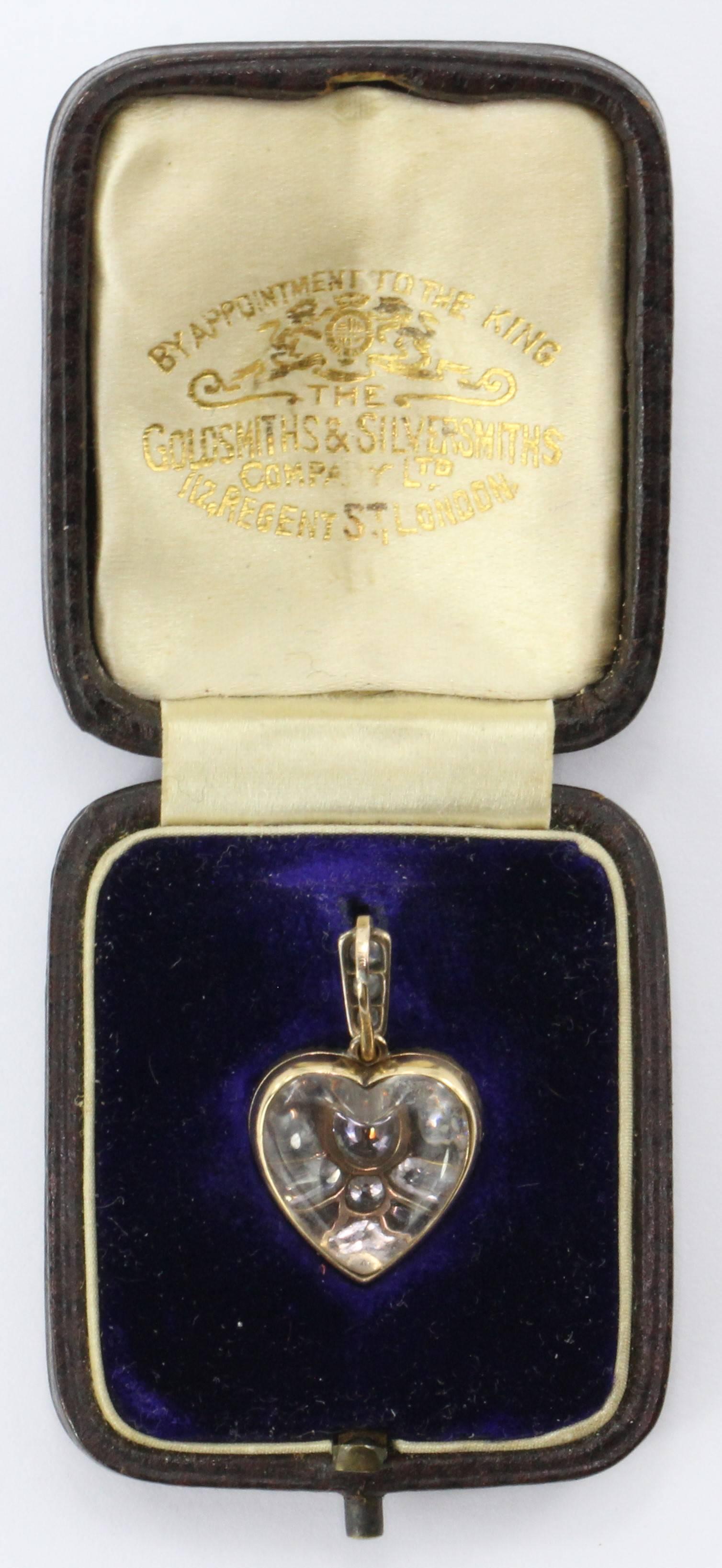 Antique Edwardian 15ct Gold Diamond Rock Crystal Heart Locket Pendant 1.25 CTW. The piece is in excellent estate condition and ready to wear. It comes in its original fitted box from the Goldsmiths & Silversmiths Company Ltd of London England. The