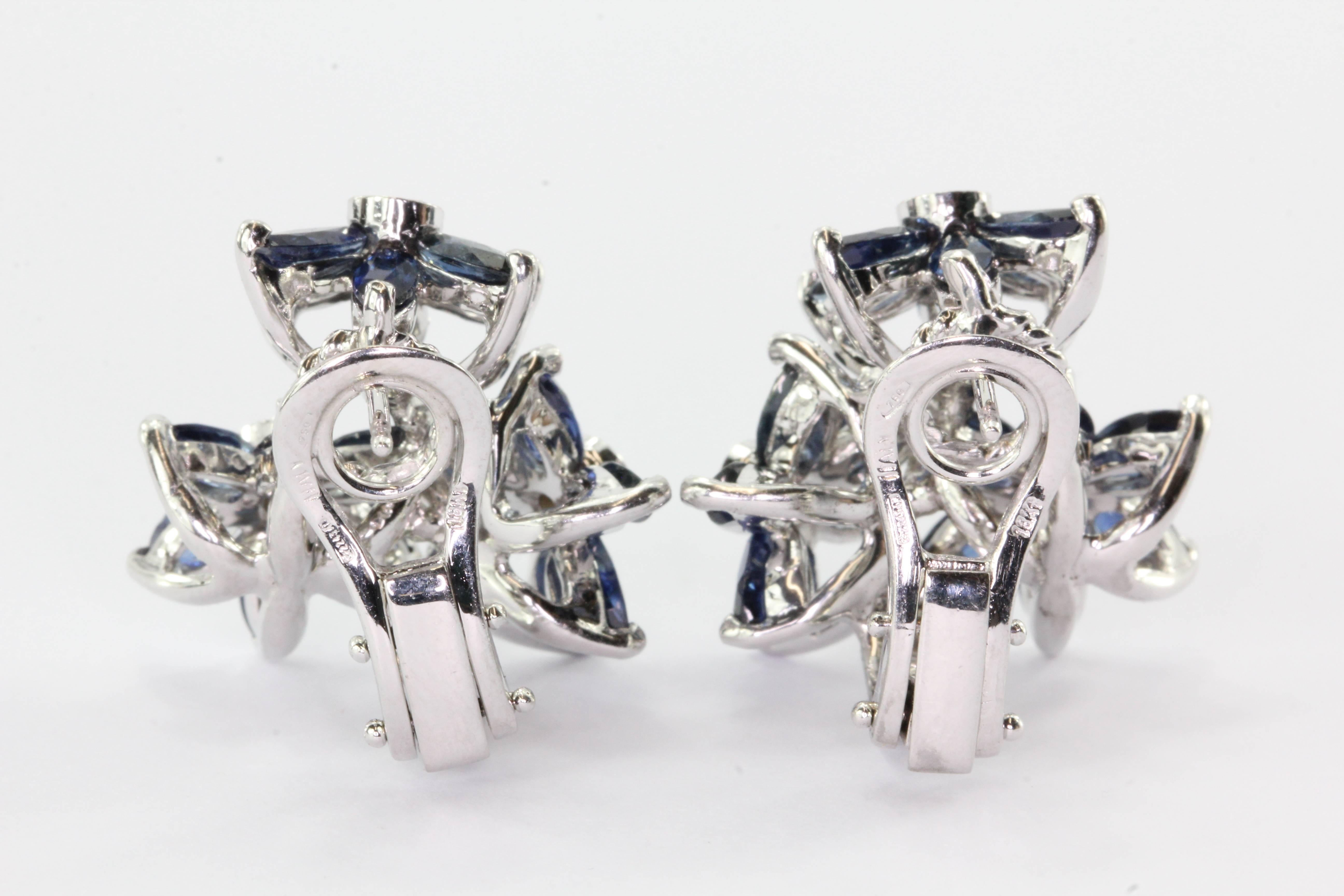 18K White Gold Sapphire & Diamond Triple Flower Earrings. The earrings are in excellent estate condition and ready to wear. They are hallmarked 
