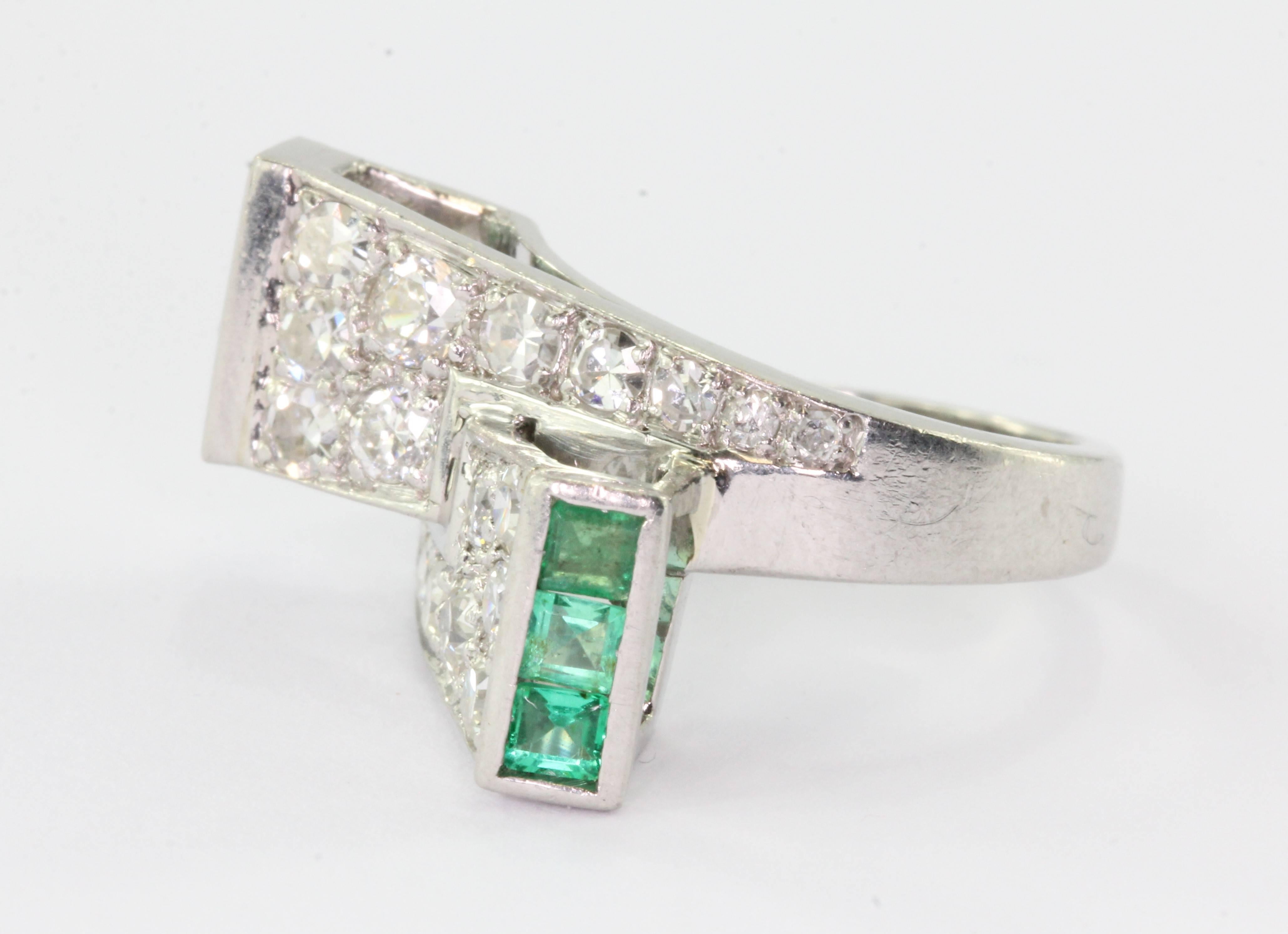 P. N. Lackritz Platinum Diamond Emerald Art Deco Ring Circa 1930's. The ring is in excellent condition and ready to wear. The ring is signed "LACKRITZ". The ring is made of platinum and set with 6 square cut natural .07 carat emeralds