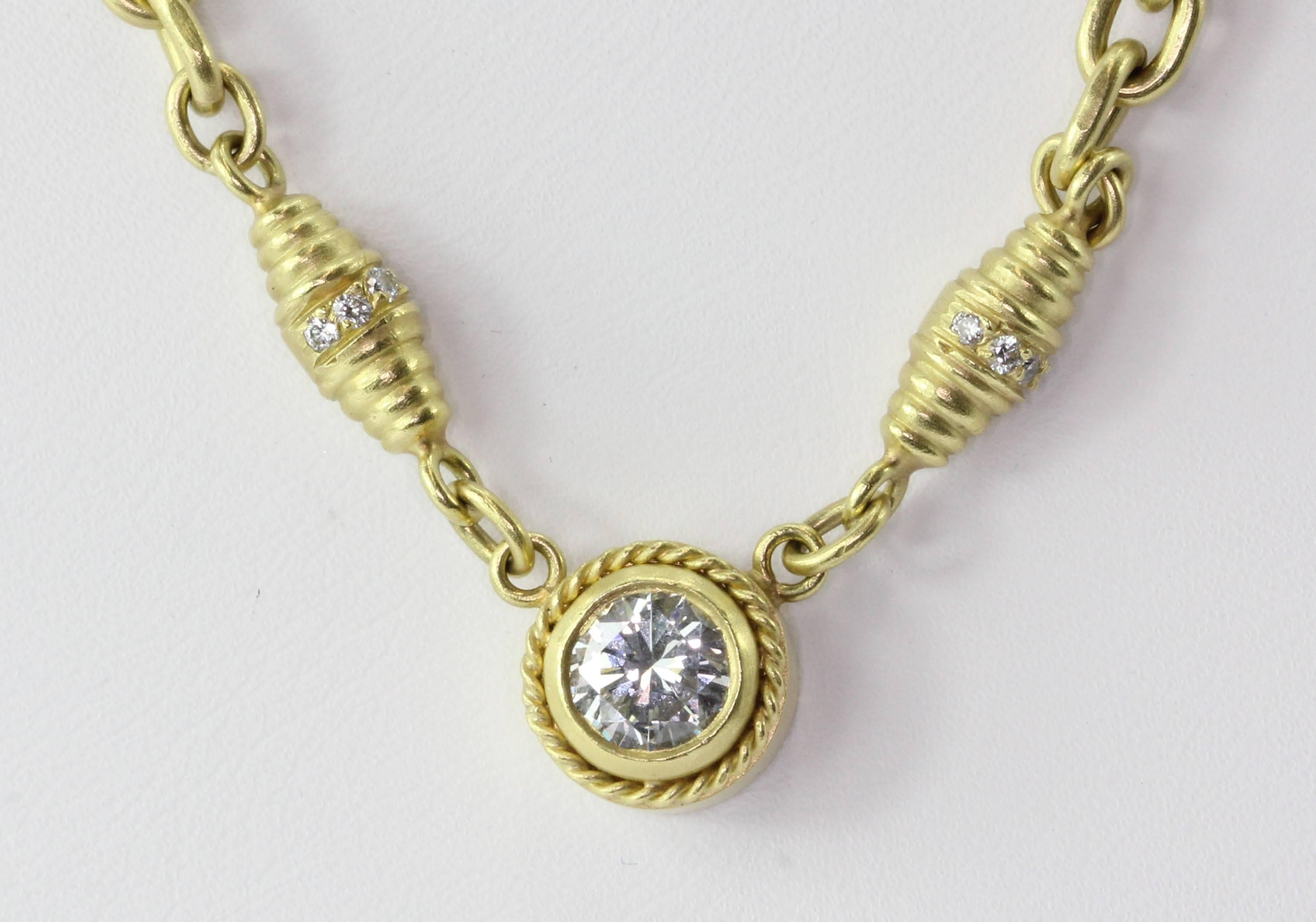 18K Brushed Finished Yellow Gold 1 Carat Diamond Solitaire Necklace. The necklace is in excellent estate condition and ready to wear. The peice is hallmarked 750. The piece has been finished in a sating or burnished finish. The center diamond is an