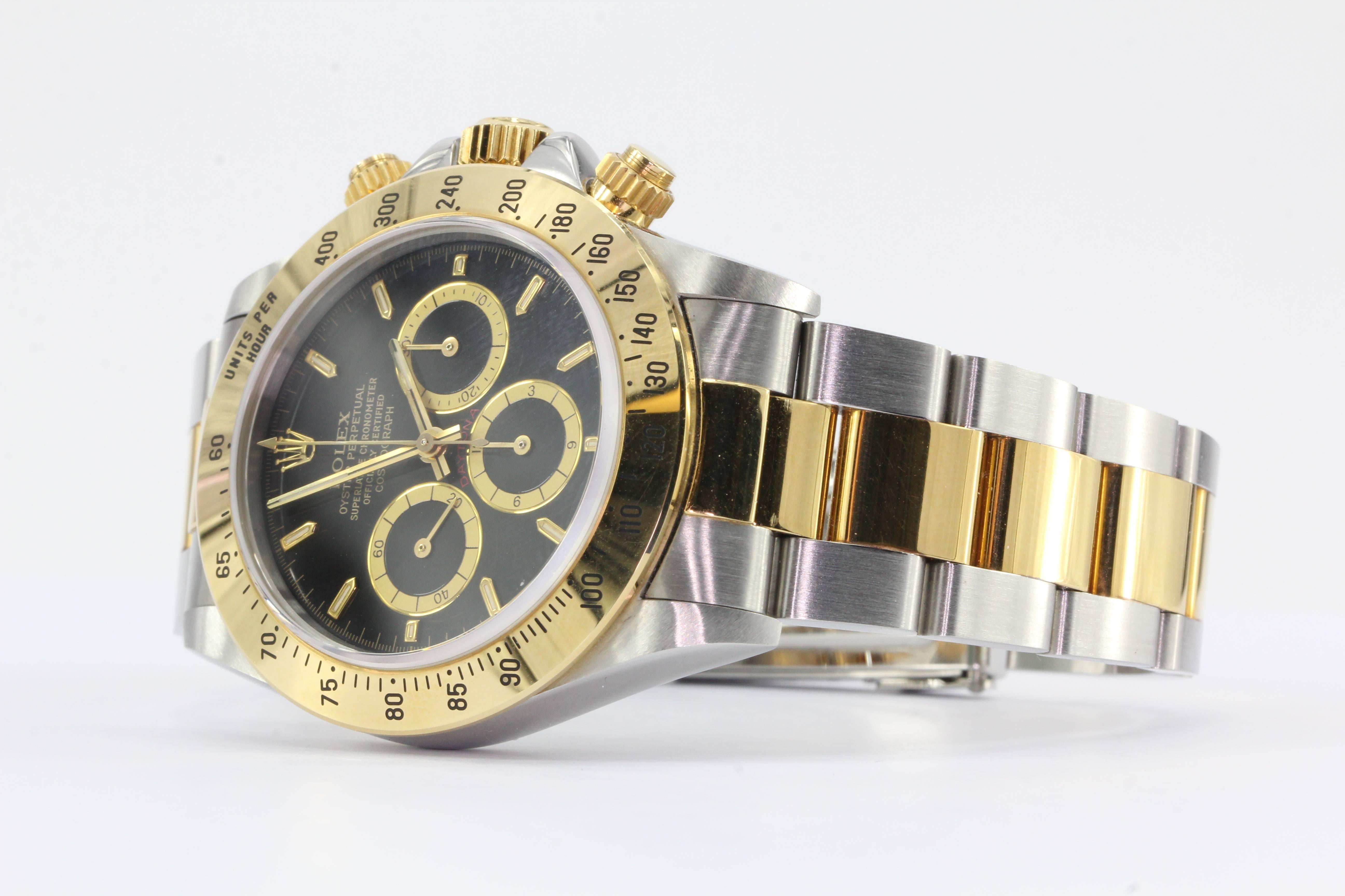 Rolex yellow gold stainless steel Oyster Perpetual Cosmograph Daytona Ref 16523 Automatic Wrist Watch for Unisex. The watch is in excellent gently used estate condition and ready to wear. It is keeping excellent time. The watch comes in its original