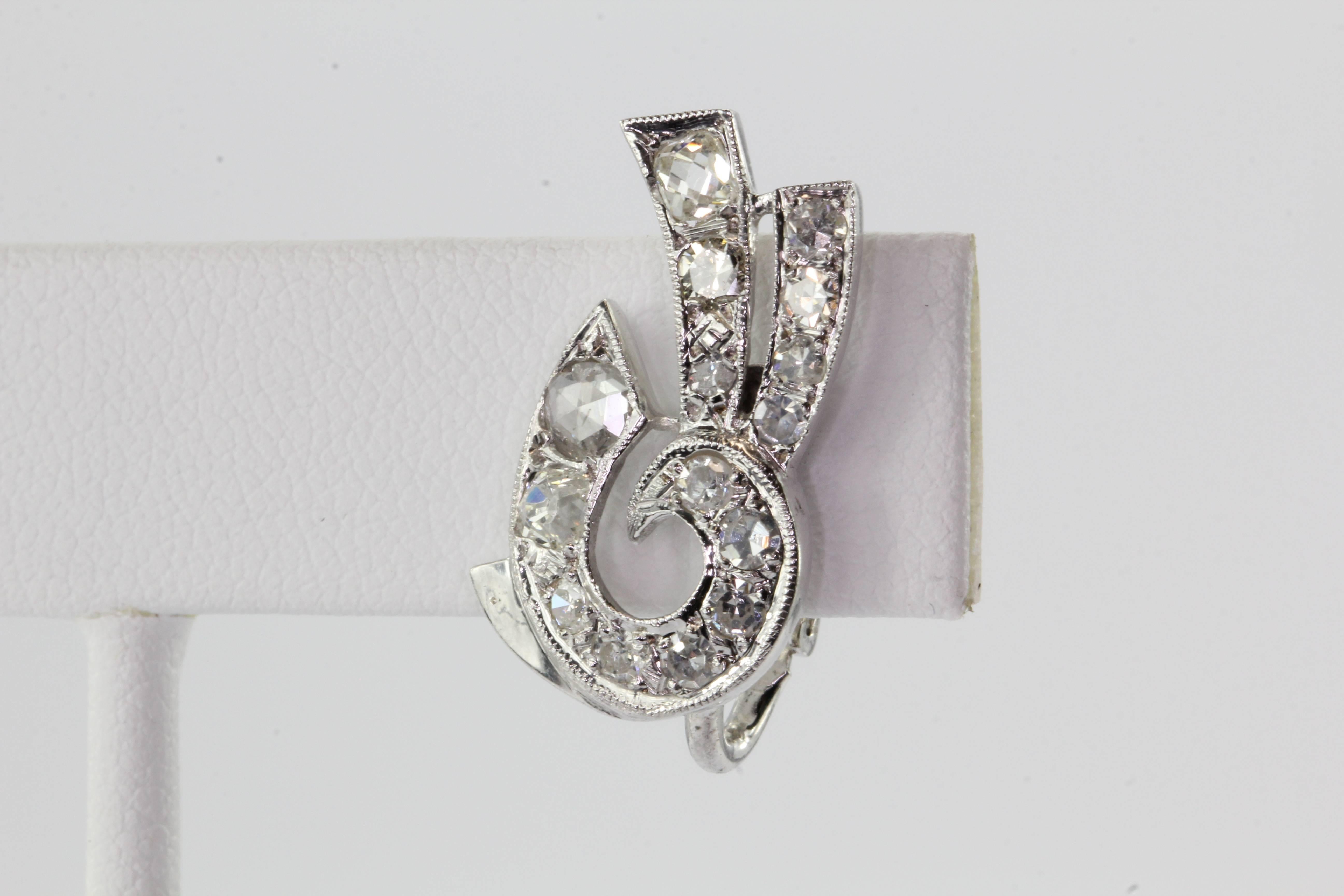 Art Deco 14K White Gold Rose & Old Mine Cut Diamond Earrings. The earrings are in excellent antique estate condition and ready to wear. The earrings are hallmarked 14K. The earring backs are most likely a later addition. The earrings are set