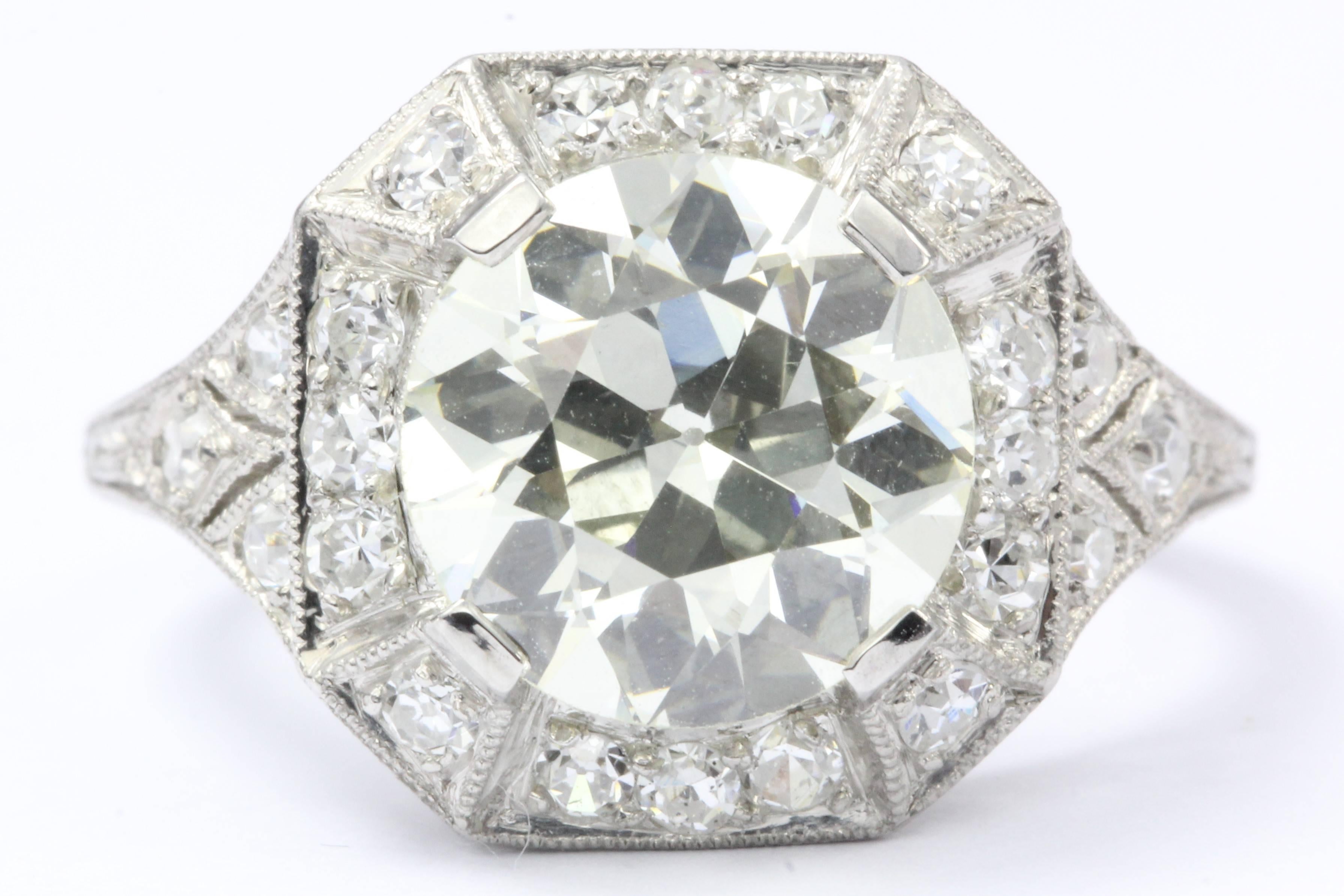 Art Deco platinum 2.86 Carat Old European Diamond Engagement Ring. The ring is in excellent estate condition and ready to wear. The design is still sharp and has no signs of wear. The main diamond is approximately 2.86 carats Vs clarity, L/M color.