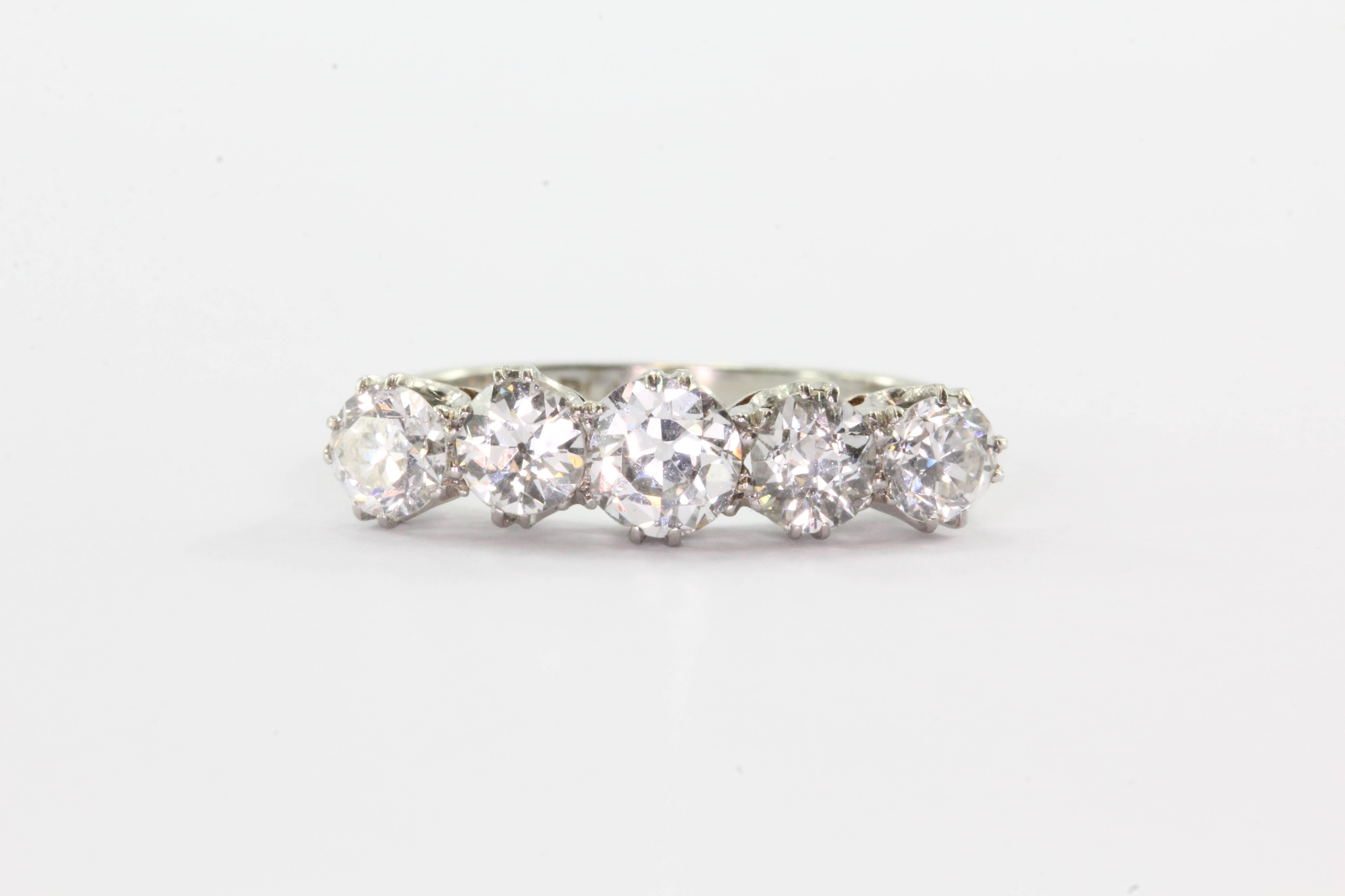 18k White Gold Platinum 1.75 Carat 5 Old European Cut Diamond Ring Band. The ring is in excellent estate condition and ready to wear. It is hallmarked 18CT Plat. It is set with 5 old European Cut diamonds that come to approximately 1.75 carats