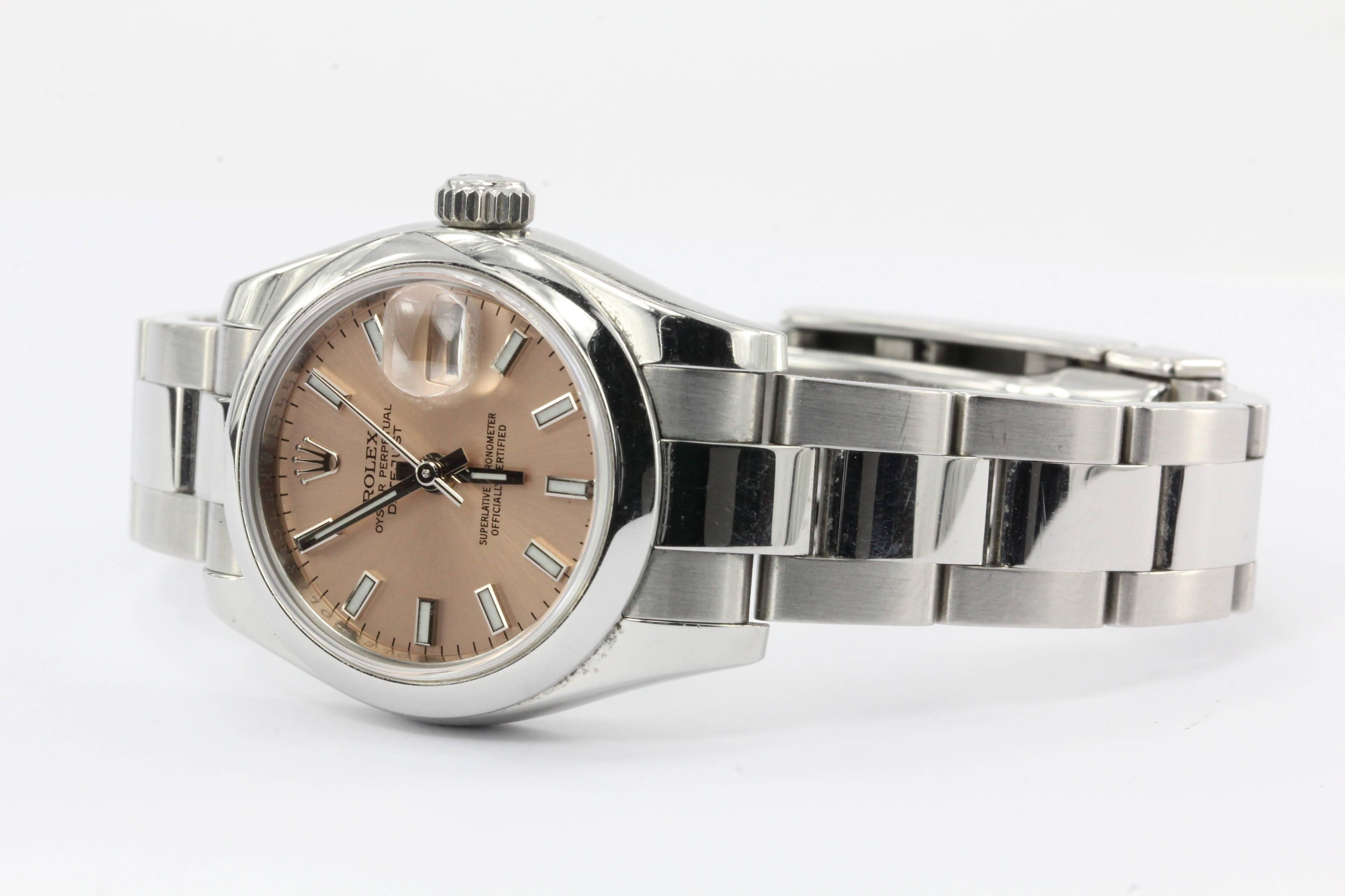 Rolex Ladies Datejust 179160 Stainless Steel custom PINK DIAL in box. The watch is in excellent gently used estate condition and running great. The watch comes in its original case and box, with its tag, paperwork and receipts. The watch dates from