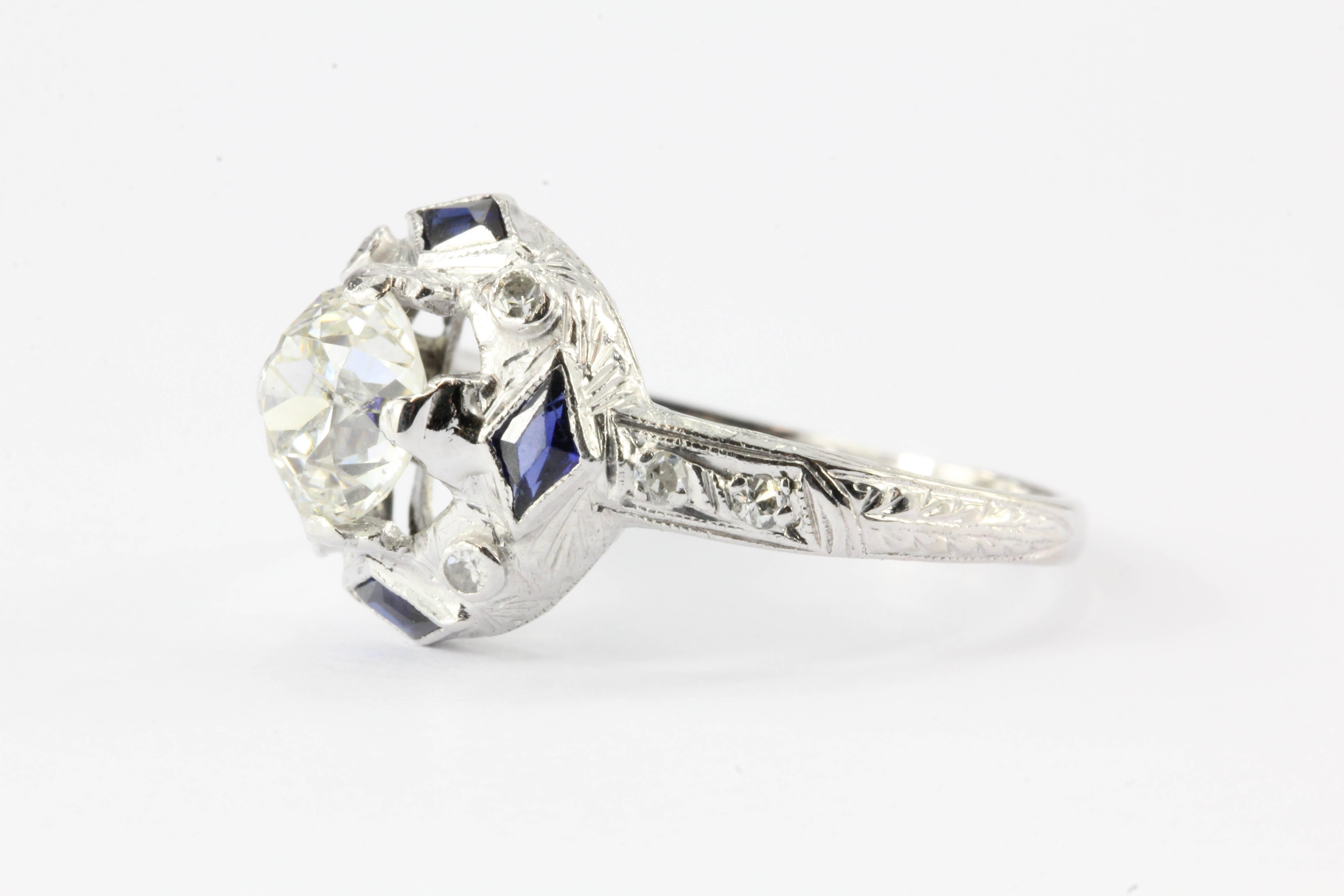 Art Deco Platinum Sapphire 1.27 Carat Old European Diamond Engagement Ring c.1925

This magnificent and grand survivor of the roaring 20's comes with all the bells and whistles one could desire in an authentic art deco engagement ring. The piece is