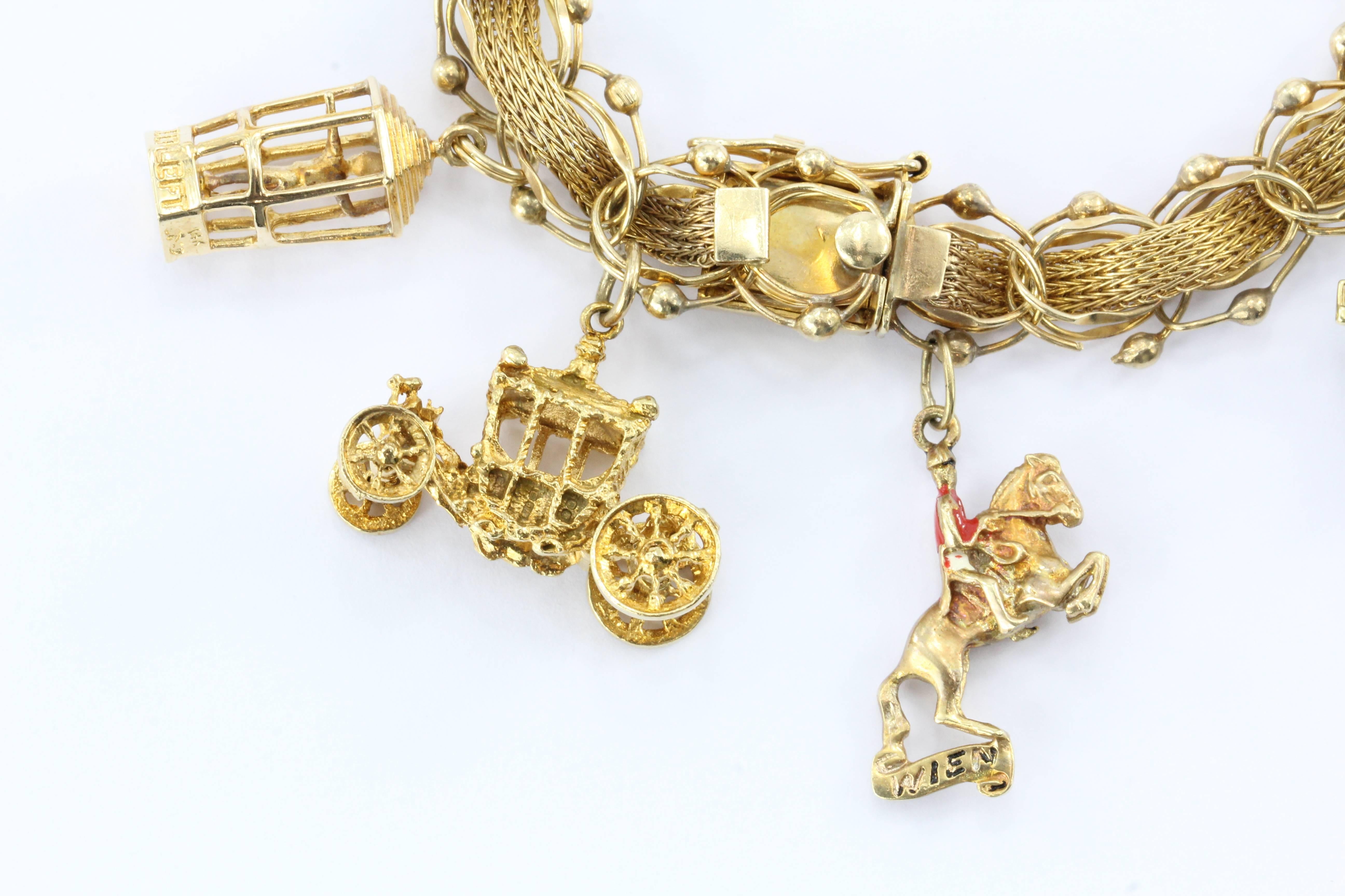 Vintage Yellow Gold World Traveler Charm Bracelet w/ 9 Charms
 
A well loved memento and testament to several journeys this charm bracelet is in excellent estate condition. The bracelet and most of the charms are 14K yellow gold, only the Eiffel