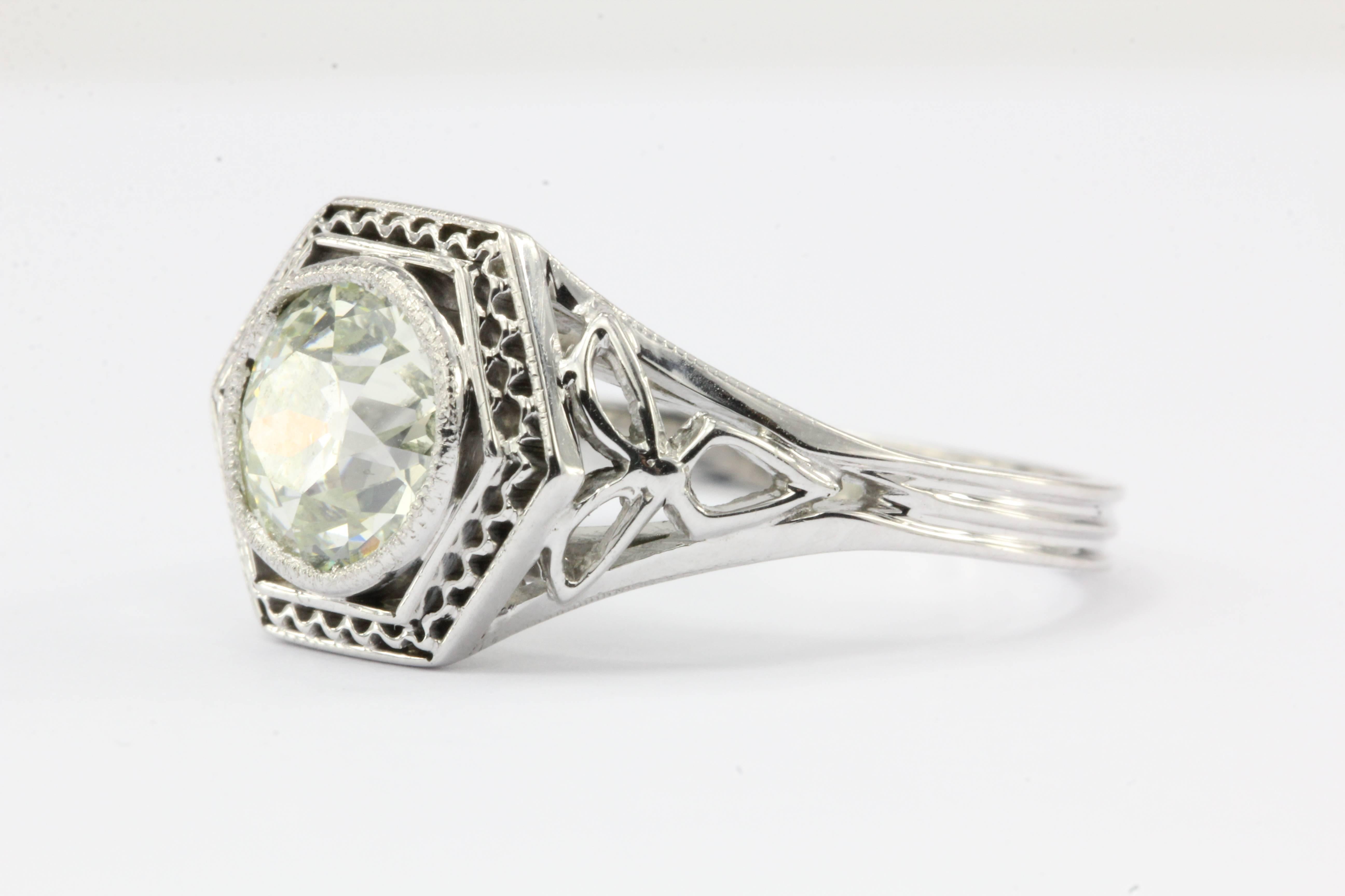Art Nouveau 18K White Gold 1.49 Carat Fancy Color Old European Diamond Engagement Ring

The fancy light yellow & green old European cut diamond catches the light as a drop of morning dew reflecting the first rays of light from the rising sun on
