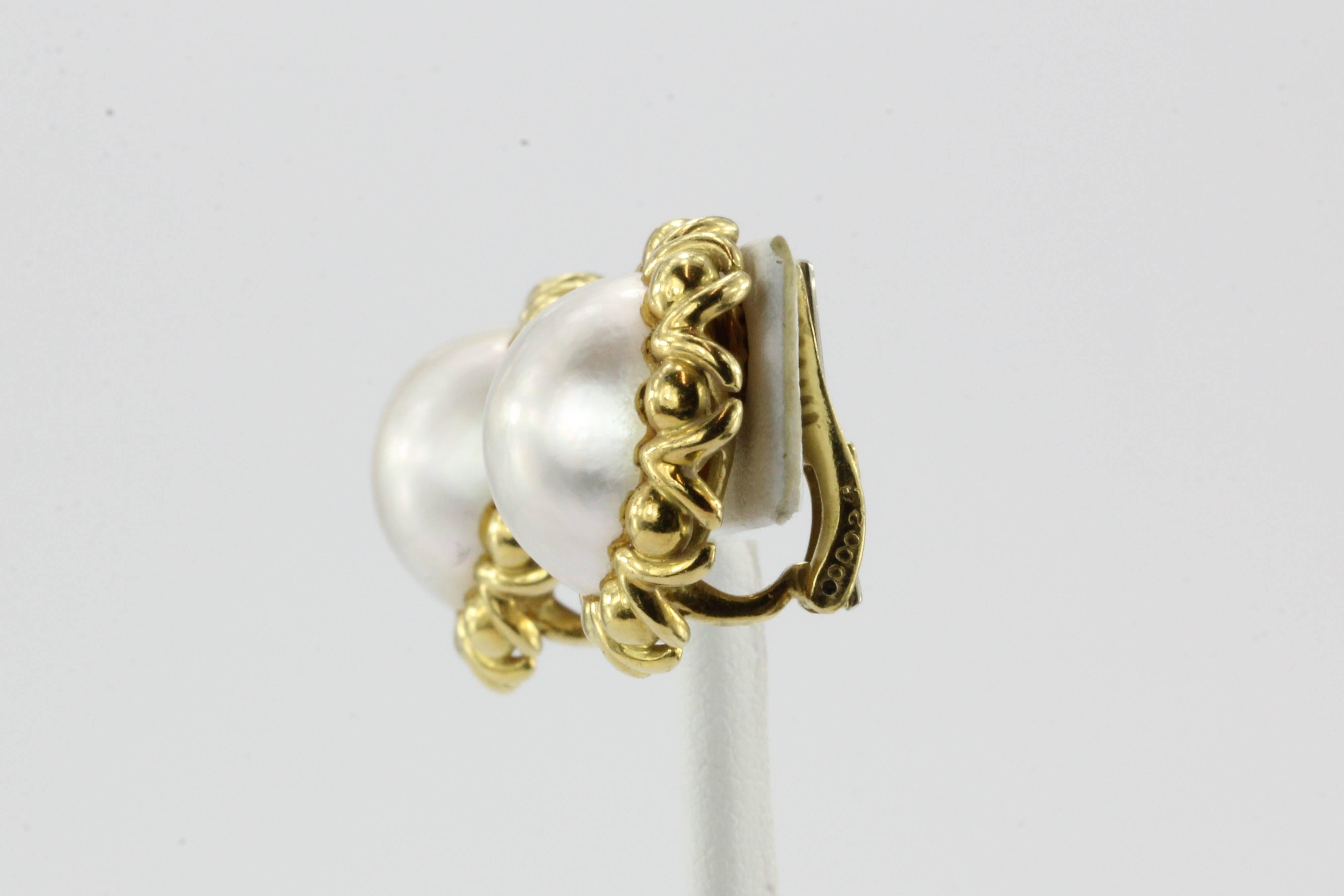 Vintage Cartier 18K Gold Mabe Pearl Clip-on Earrings

The earrings are in excellent used estate condition and ready to wear. They are both signed "Cartier 00028 18K". The earrings measure about 23mm in diameter and together they weigh a