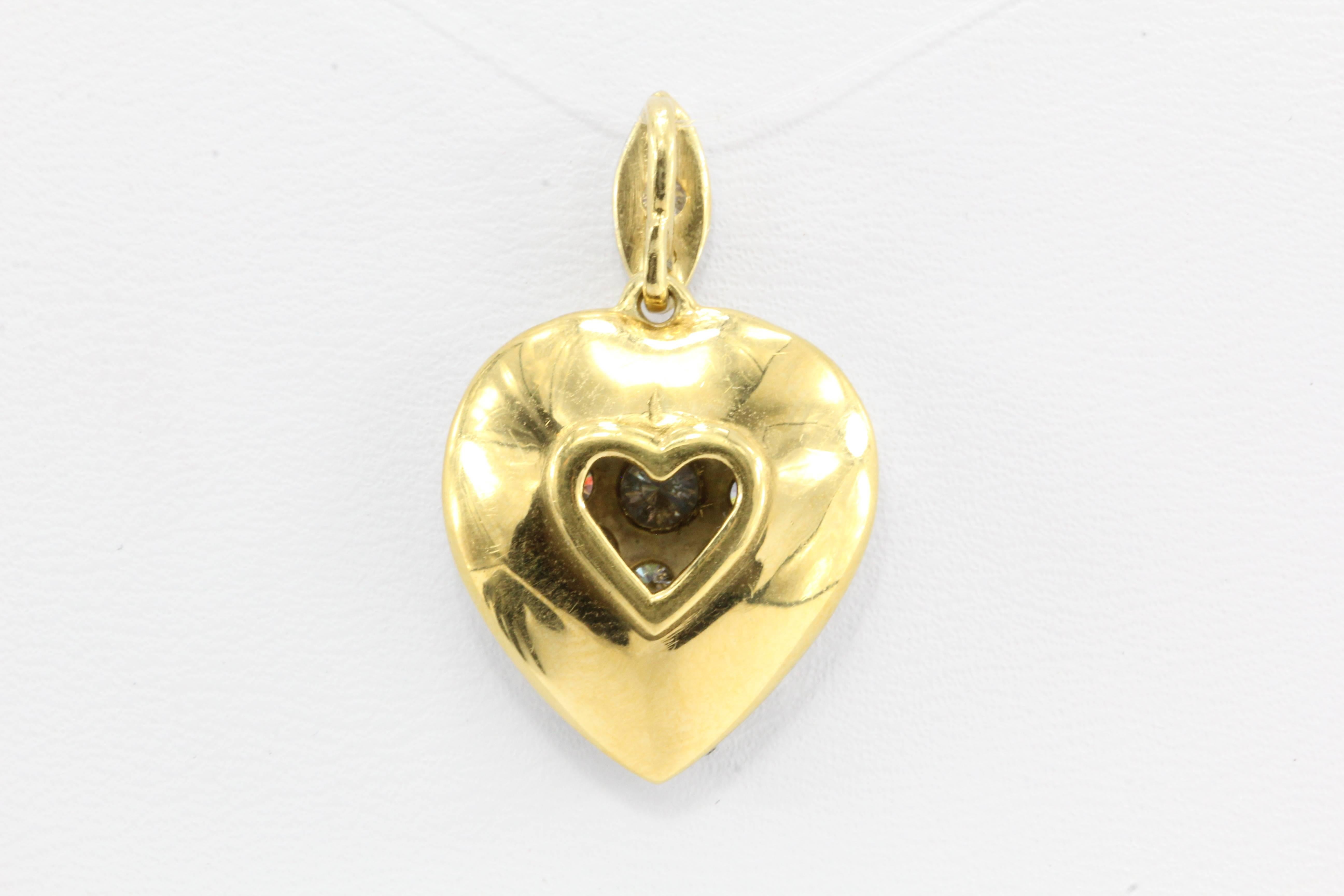 An Edwardian token of affection in the form of a diamond confection in one precious pendant. The heart features 1.5 carats of Old European Cut diamonds that bring such light and joy to this piece. 

Era: Edwardian

Composition: 18K Yellow Gold with