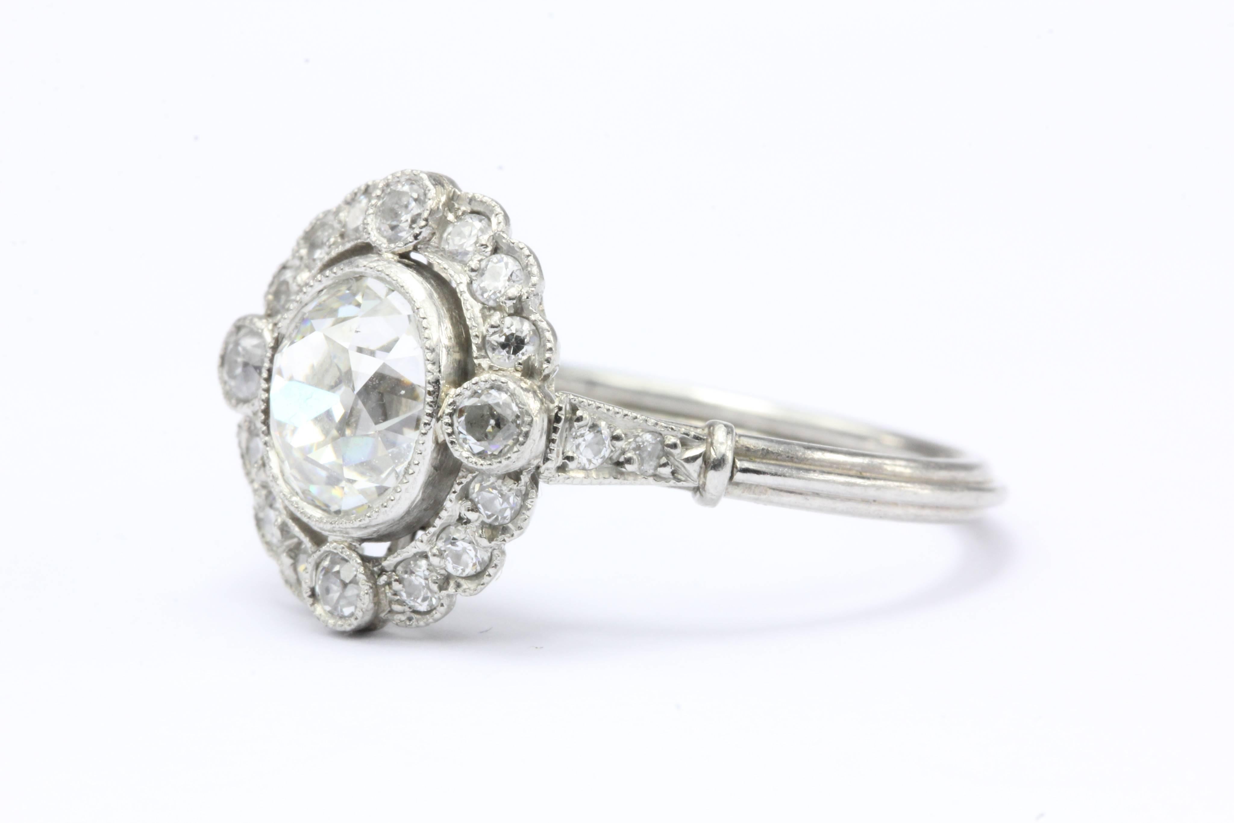 Edwardian Platinum Old Mine Cut Diamond Halo Engagement Ring c.1910

This spectacular ring's diamonds are set exactly like the She-Loves-Me flower constellation that only comes out every February 17 night. The center is approximately 1.1 carat old