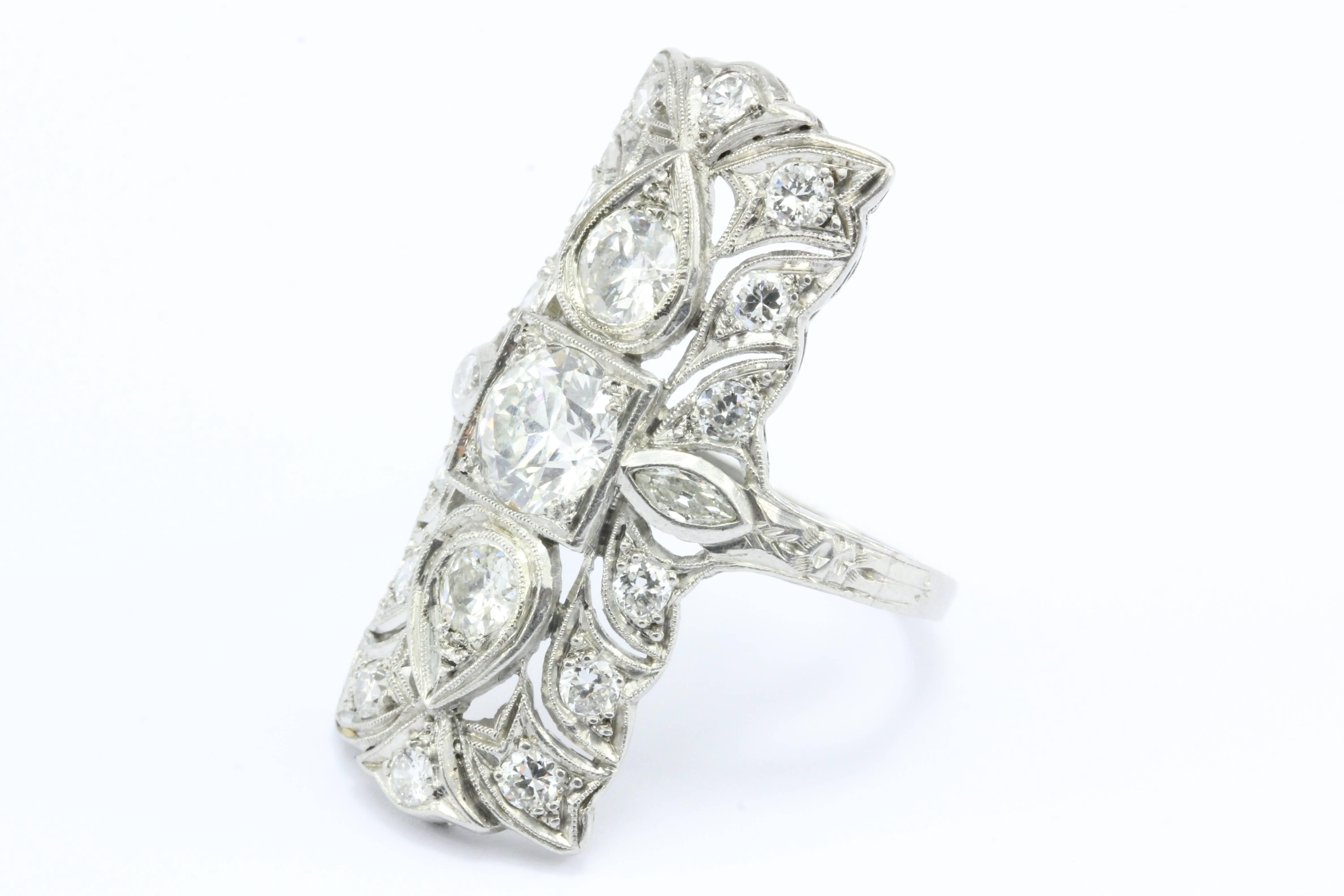 Art Deco Platinum Three Stone Old European Diamond Shield Ring 3.65 CTW

A ring for America's modern royalty, this glamorous piece of antique Art Deco jewelry is one of the most magnificent pieces to ever come our way. The ring is made of platinum