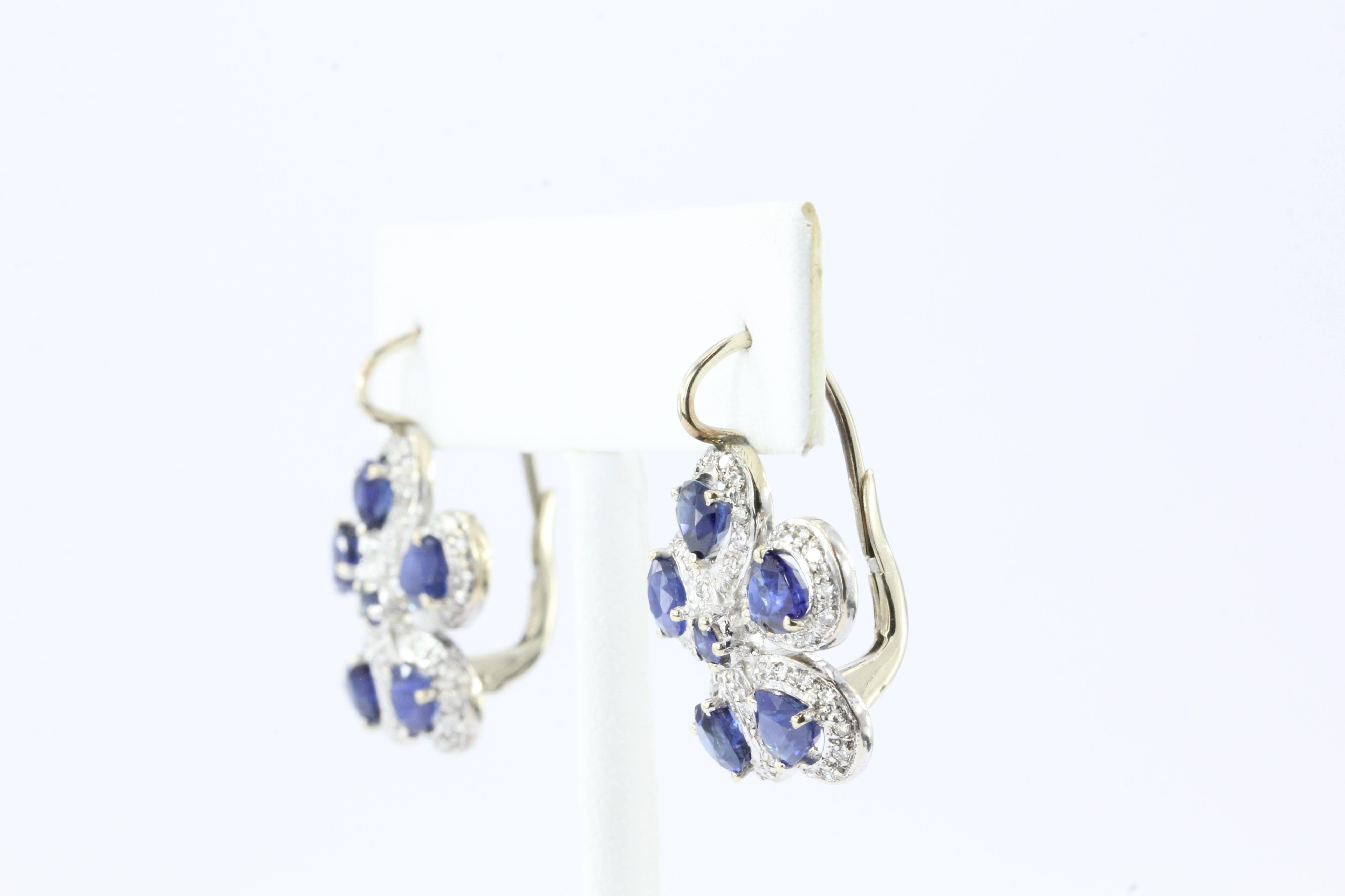 Retro 14K White & Yellow Gold Natural Blue Sapphire & Diamond Earrings

These adorable and elegant hand crafted five petal flower earrings are set with natural blue sapphires and diamond outlines. There is approximately 2 carats of natural
