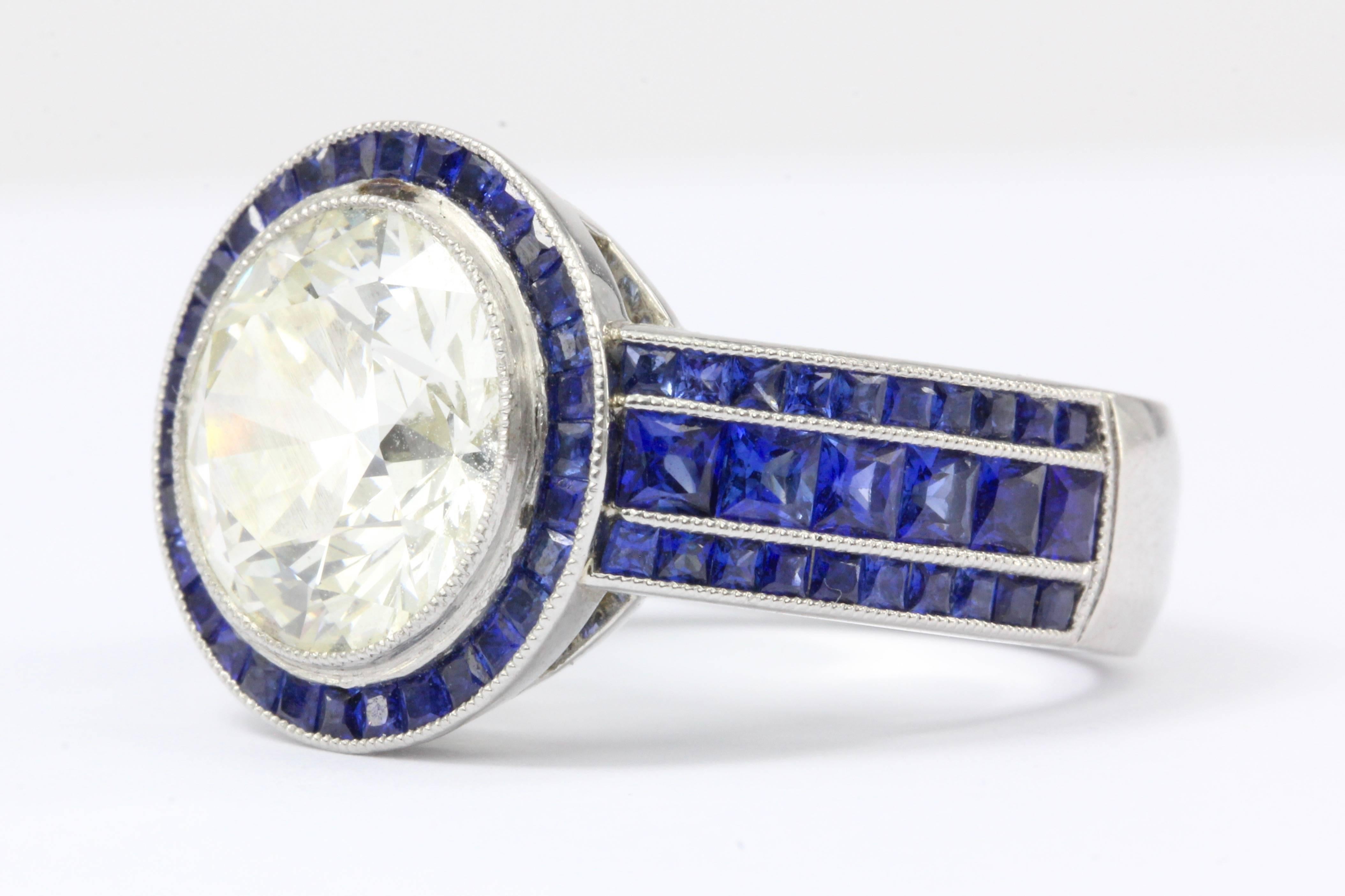 4.03 Carat Diamond w/ 2 carats of Sapphires Platinum Engagement Ring

Like a bright brilliant full moon filling the darkness of a sapphire blue night this diamond couldn't be more perfectly set. The mounting is platinum, the center round brilliant
