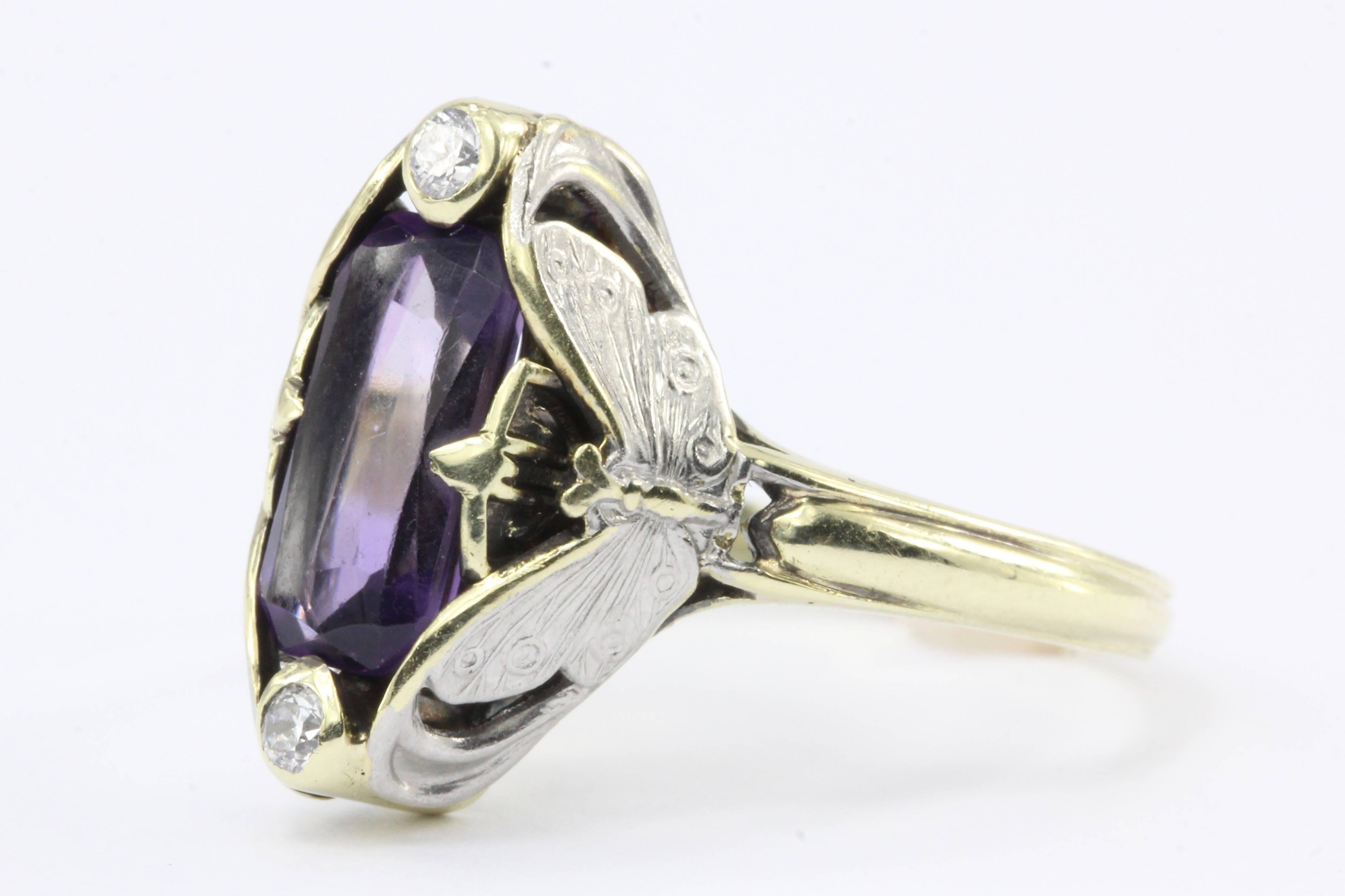 Art Nouveau Allsopp Bros. 14K Multi-tone Gold Butterfly Amethyst Ring c.1900

Two elegant white gold butterflies with outstretched wings, hug a deep purple amethyst and two diamonds on this authentic Art Nouveau masterpiece. It is signed A*14K which