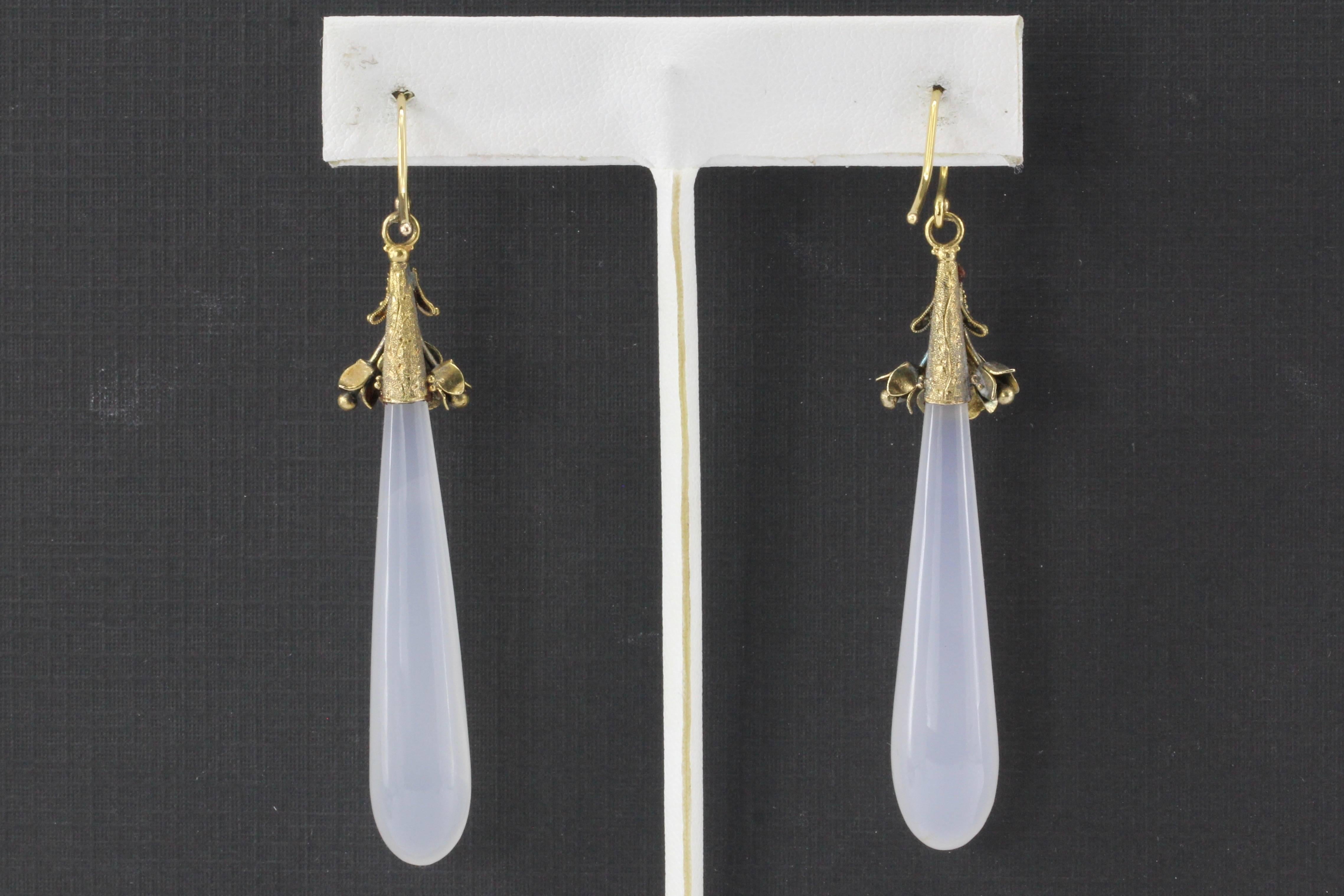 Victorian 15K Gold White Chalcedony Drop Dangle Earrings c.1840's

Era: Victorian c.1840's. The earrings are of English origin.

Composition: 15K Yellow Gold

Primary Stone: White Chalcedony

Earring Measurements: 2.5"  (2.75" w/ hook) x