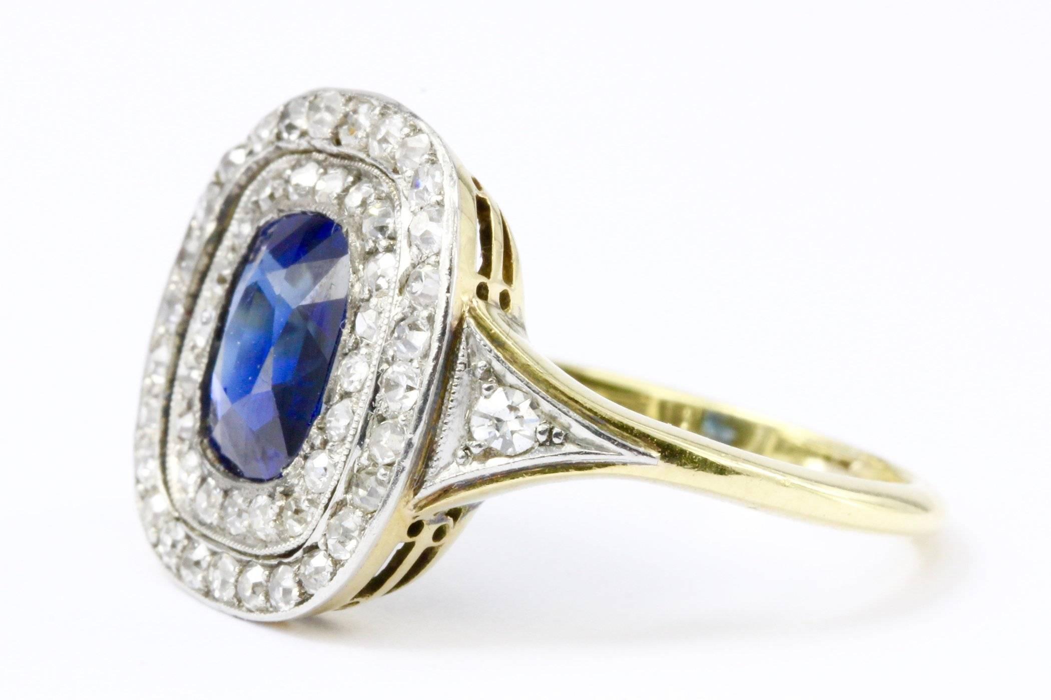 Era: Edwardian

Main Stone: GIA Certified Natural No Heat Cushion Cut Sapphire

Approximate Carat Weight: 1.75 Carats 

Diamonds: .5ctw Single Cut Old Euro's

Clarity: Vs2-Si2

Color: H-K

Ring Size 6.75

Ring Measurement: 15mm x 15mm

Ring Height: