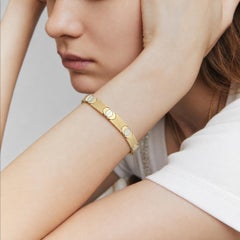 Bracciale vintage con maglie reversibili e motivo a testa di vite, in oro bicolore 14 carati