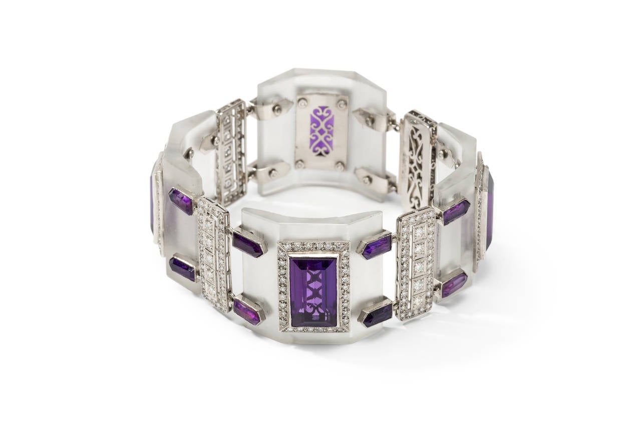 Argentina, about 1975. Set with 4 large and 16 small amethyst on rock crystal boards, accented by 324 brilliant-cut diamonds. Mounted in platinum. Total weight: 102,23 grams. Length: 7.99 in ( 20,3 cm ), Width: 1.38 in ( 3,5 cm )

