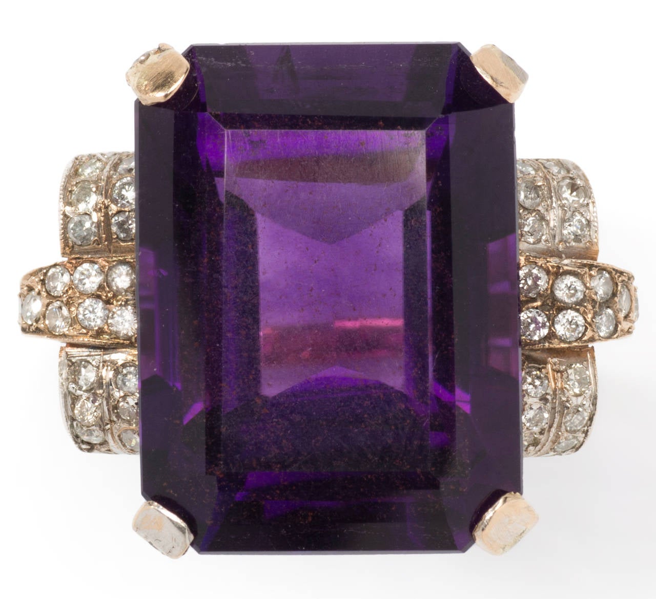 France, 1930s. It is a marvelous example for the piece of Art Deco jewellery.
Large Amethyst ( 20,13 x 14,98 x 11,42 mm ) weighing circa 19,91 ct. accented by 50 diamonds weighing ca. 0,48 ct. Mounted in 18 carat yellow gold. 
Total weight: 8,45