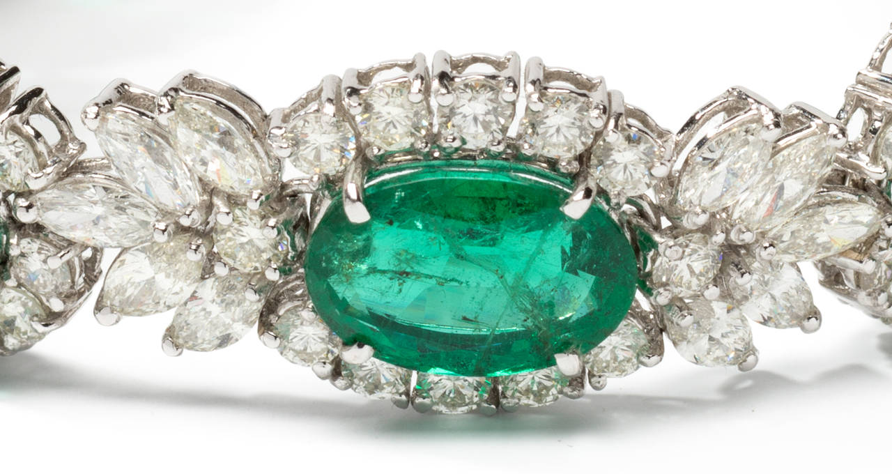 1950's-1960's. Set with 8 oval-shaped emeralds with a total weight of circa 21,88 carats, 131 diamonds in brilliant-cut and navette-cut weighing circa 13,54 carats. Mounted in 18K white gold. Weight 34,2 g. Length: 7.28 in ( 18,5 cm ), Width: 0.59
