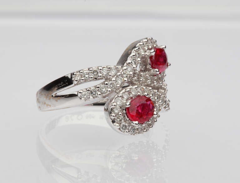 Set with 2 oval-shaped rubies weighing approximately 1,06 carats and 60 diamonds weighing circa 0,76 carats. Mounted in 18 K white gold. Hallmarked inside the shank: 750, 18K 076 R1 06 D. Total weight: 7,2 g. Re-sizable