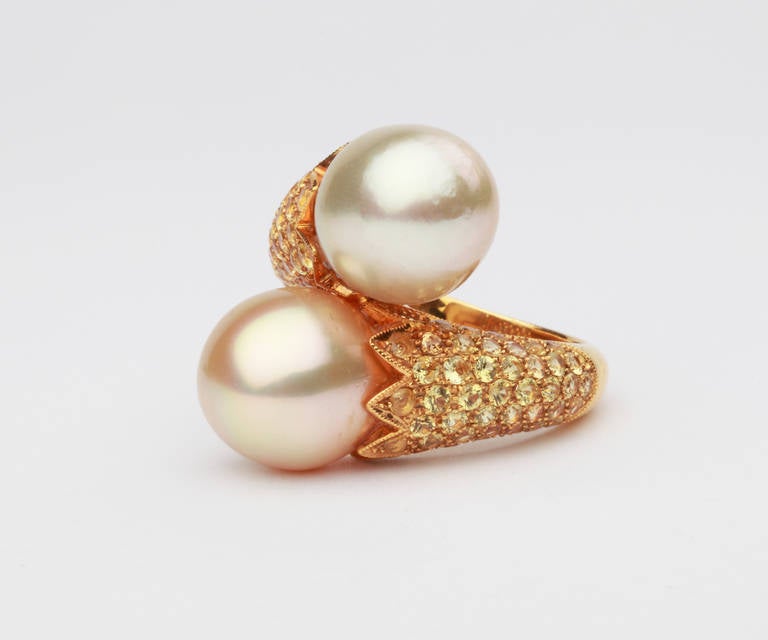 This is a beautiful large pearl ring, it is stunning crafted with diamonds on the shank providing a touch of elegance. The South Sea pearls measuring 11,8 mm in diameter, with a nice luster and shine. The shoulders enhanced by 88 brilliant-cut fancy