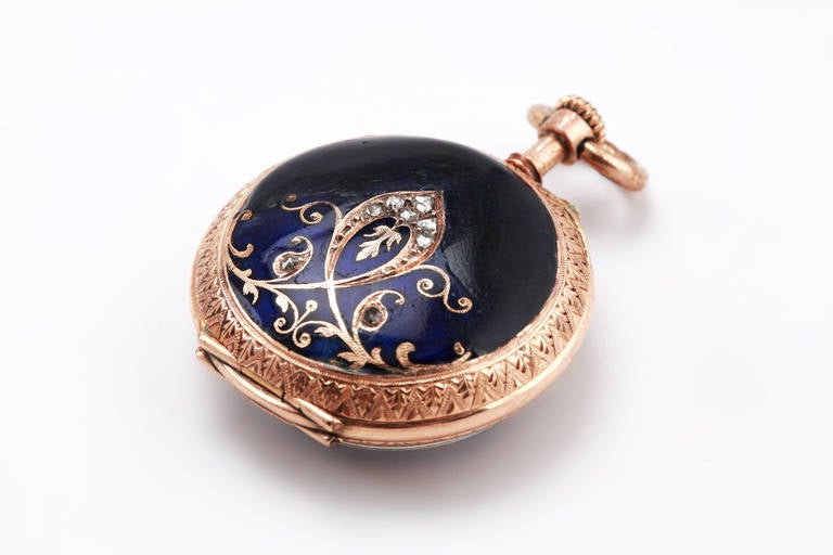 Enamel and gold pocket watch, around 1900. The blue enamel dial with applied 12 hours Roman numerals and 30 minute register. Decorated with 8 diamonds. The watch case is made in 14K gold. Watch case cover is hallmarked; squirrel, crown and purity