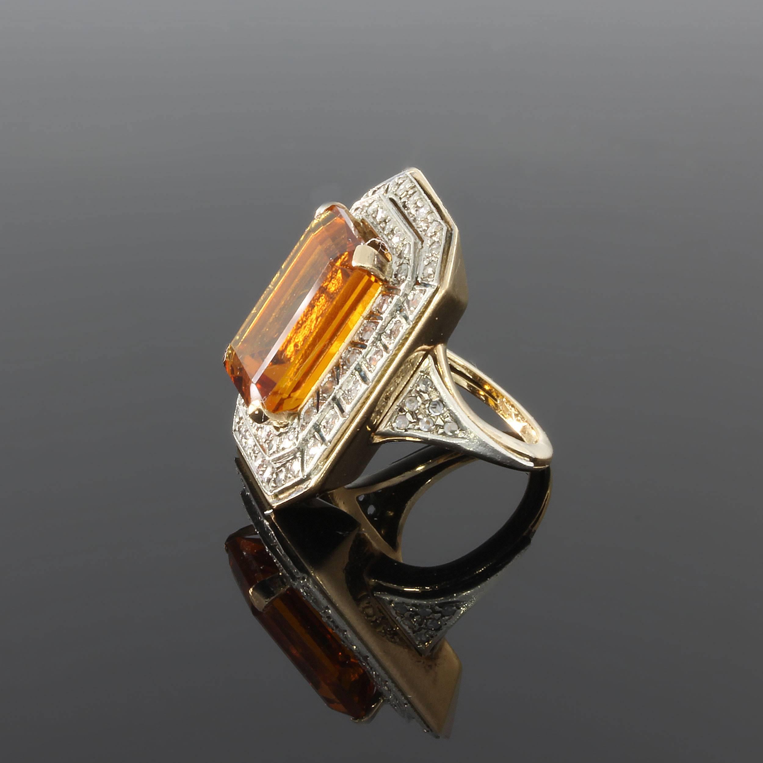 Set with precious citrine in emerald cut 0.63 x 0.43 in ( 1,6 x 1,1 cm ), height 0.12 in ( 0,3 cm ). 
Decorated with 52 diamonds in brilliant cut weighing ca. 1,5 ct. Mounted in 14K yellow gold and silver. 
Total weight 19,87 grams. Length 1.12 in (