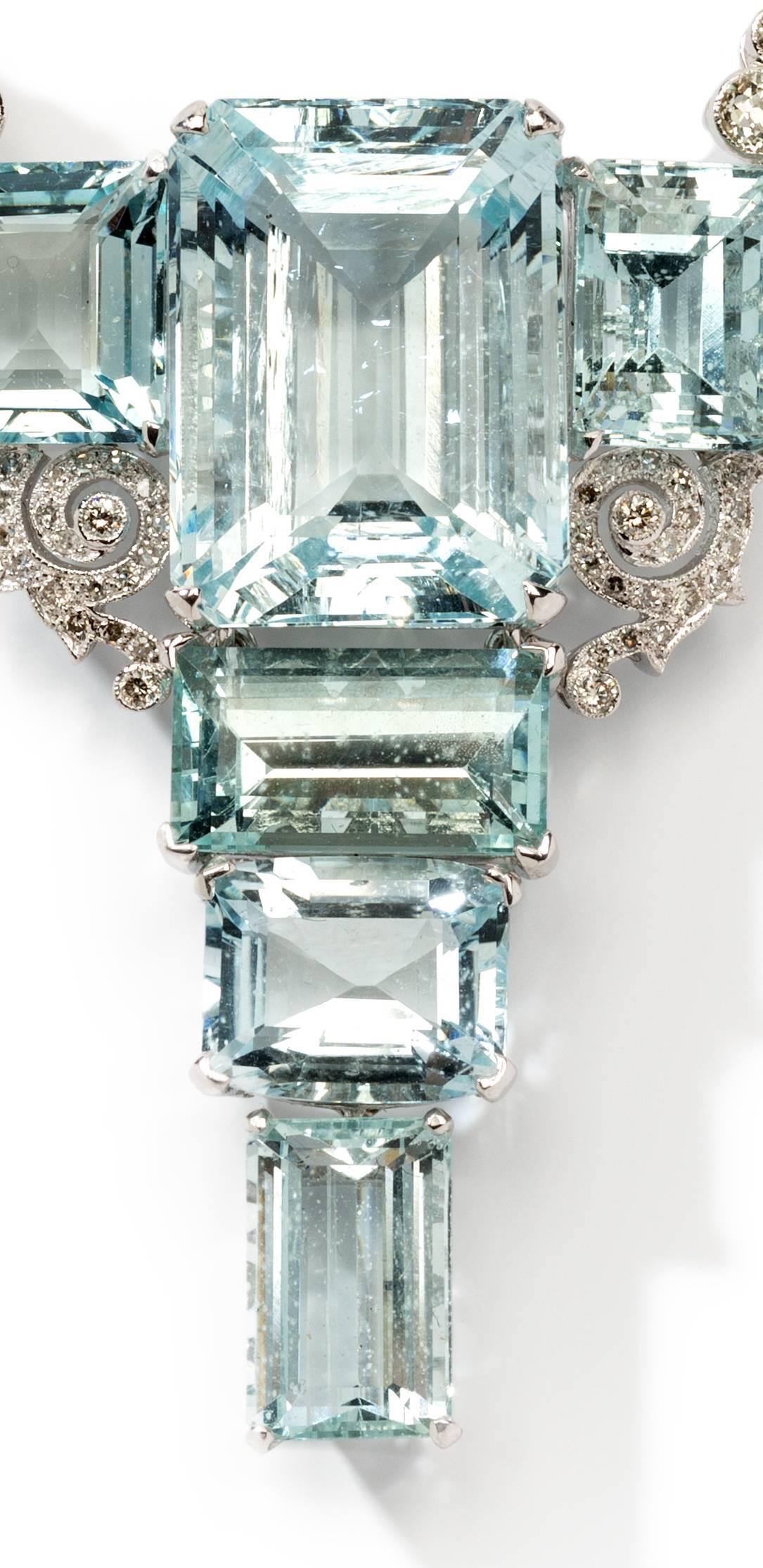 Set in style of Art Deco, Italy, 1960s. With 6 splendid aquamarines adorned with 106 brilliant-cut diamonds, all ca. 2,14 carats. Mounted in 18K white gold. Millegrain setting. Chain is hallmarked: 750, ITALY. Total weight: 29,92 grams. 
Pendant